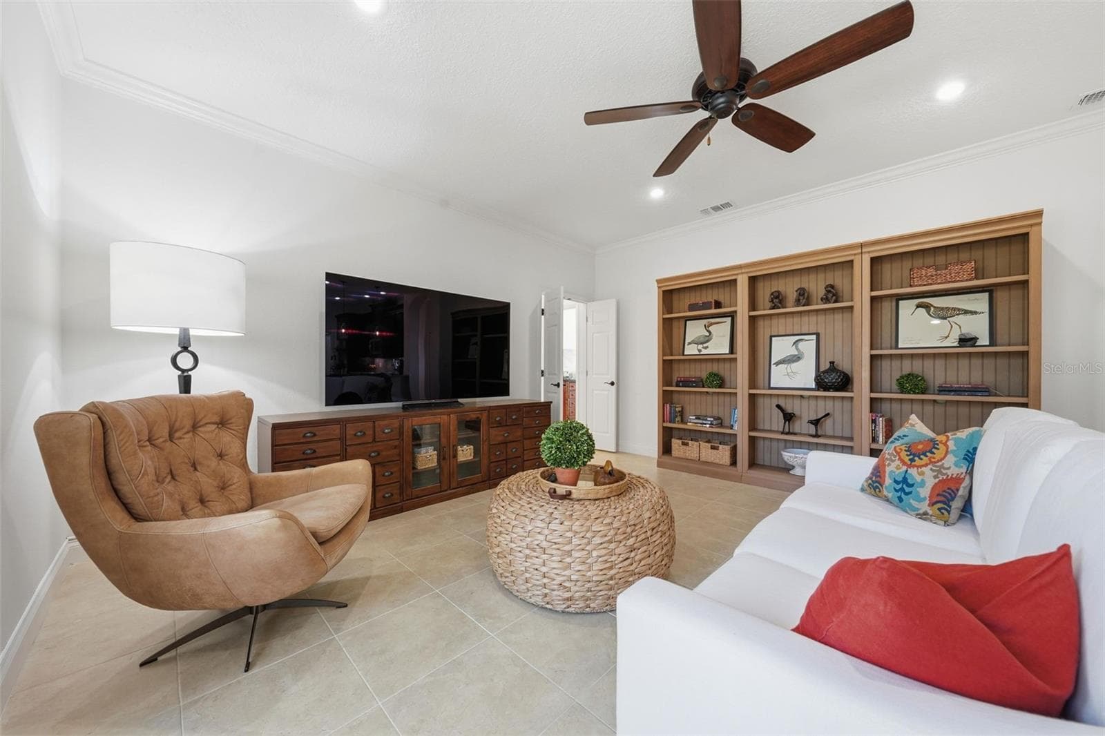 GENEROUS SIZED FAMILY ROOM WITH DOORS CLOSING OFF THE 4TH BEDROOM AND 3RD BATH FOR PRIVACY - 13850 BLUEWATER CIR, ORLANDO