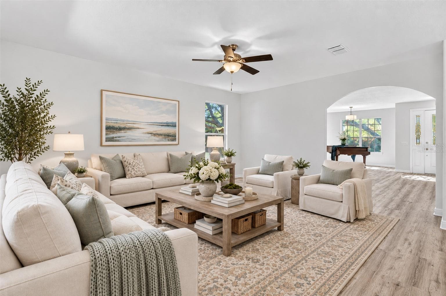 The family room facing the backyard and adjacent to the kitchen. Virtually staged to help you envision your future here. - 1305 WINDY BLUFF DR, MINNEOLA