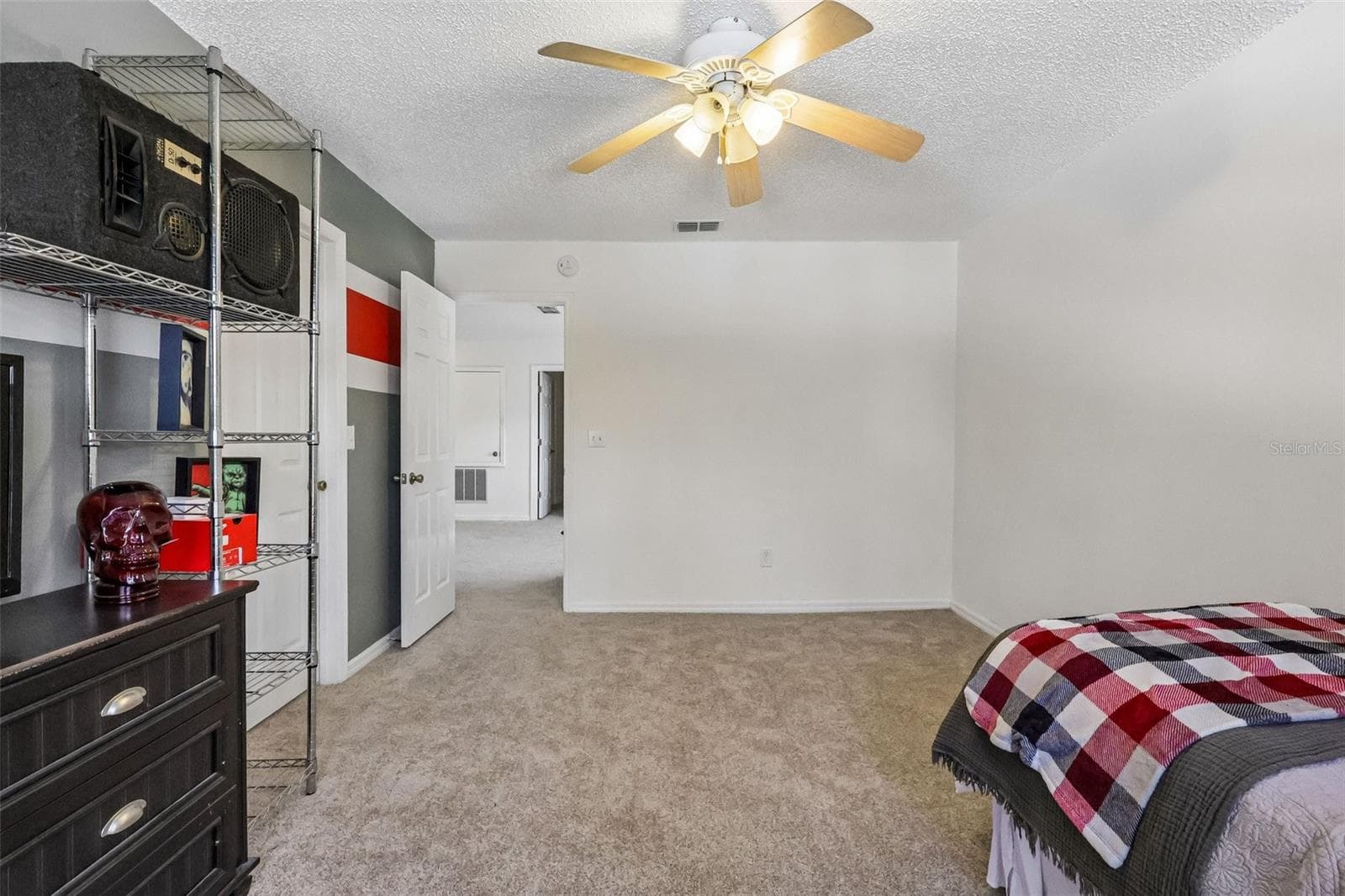 2 of 4 total bedrooms upstairs -- one at each corner of the house. This one has a LARGE WIC. - 1305 WINDY BLUFF DR, MINNEOLA