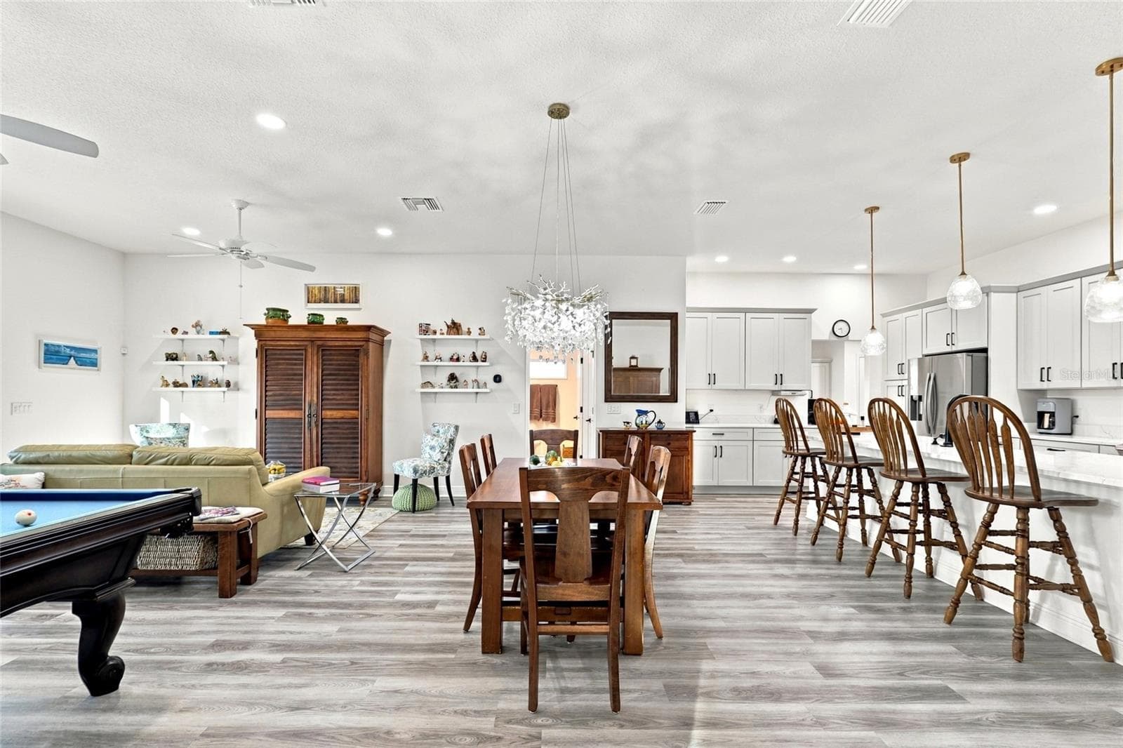 Dining Room with Living Room to the left and Kitchen to the right - 614 LAKE CREEK CIR, THE VILLAGES