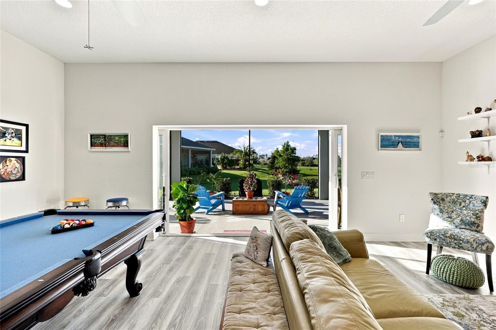 Living room toward Lanai - 614 LAKE CREEK CIR, THE VILLAGES