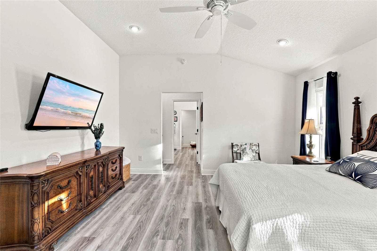 Primary Bedroom with view toward en-suite and closet - 614 LAKE CREEK CIR, THE VILLAGES