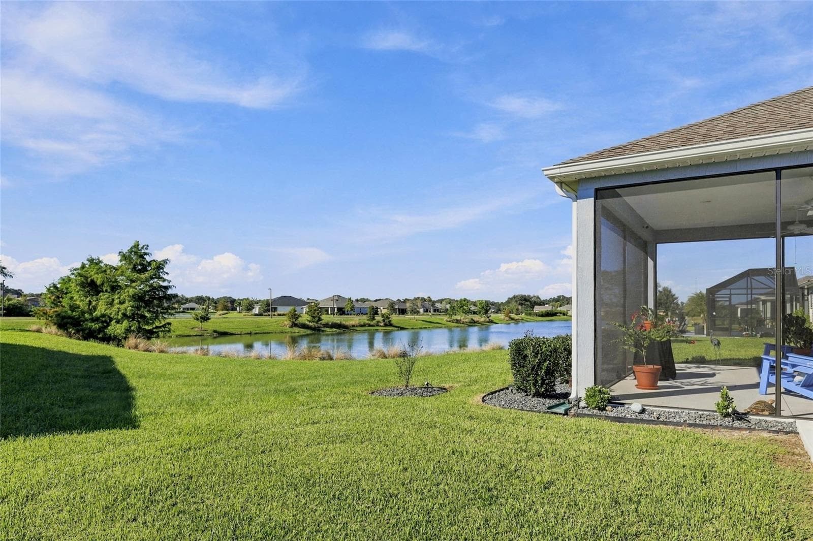 Back Yard with Pond View - 614 LAKE CREEK CIR, THE VILLAGES