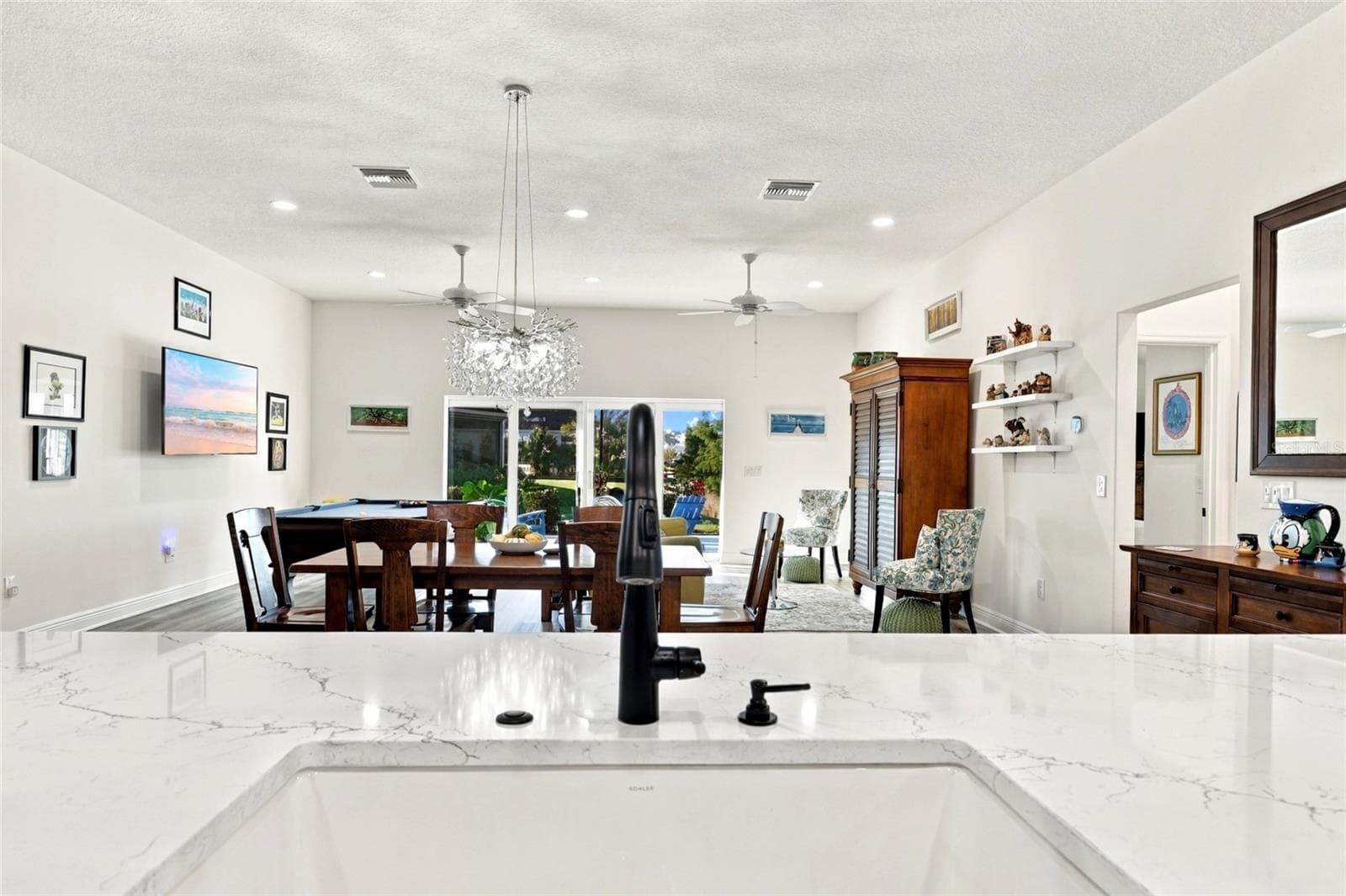Main Living Area from Kitchen Sink - 614 LAKE CREEK CIR, THE VILLAGES