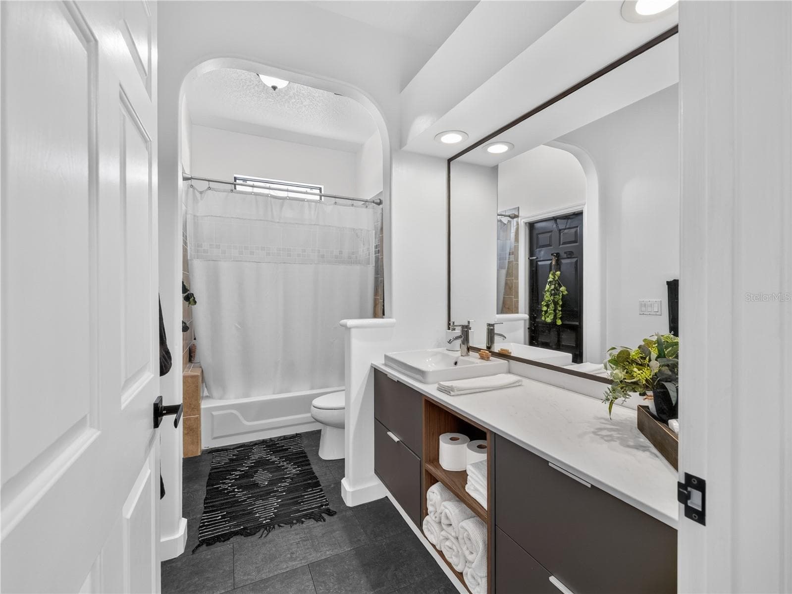 The third full bath is conveniently located near the second and third bedrooms. - 1854 VISTA ROYALE BLVD, ORLANDO