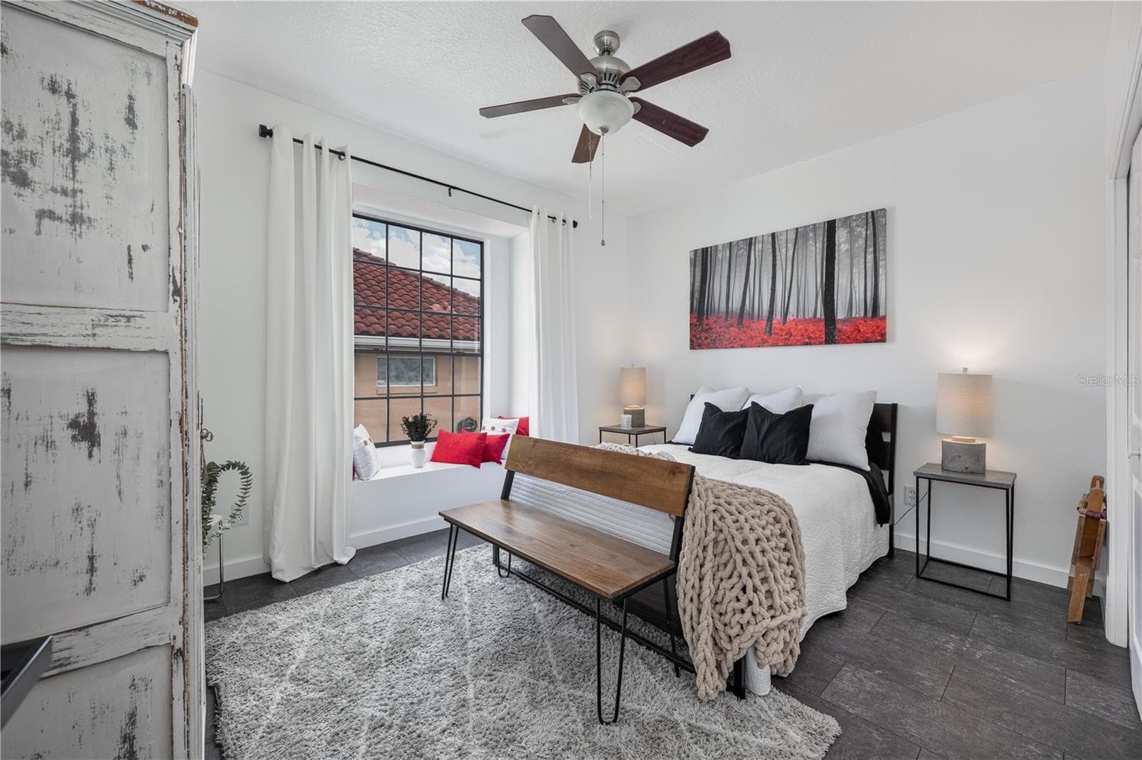 The charming window seat in this secondary bedroom is the perfect spot to read a book. - 1854 VISTA ROYALE BLVD, ORLANDO