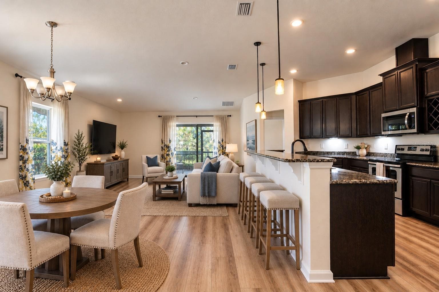 Dining and great room -virtually staged - 110 GLENEAGLE GRANDE DR, DAYTONA BEACH