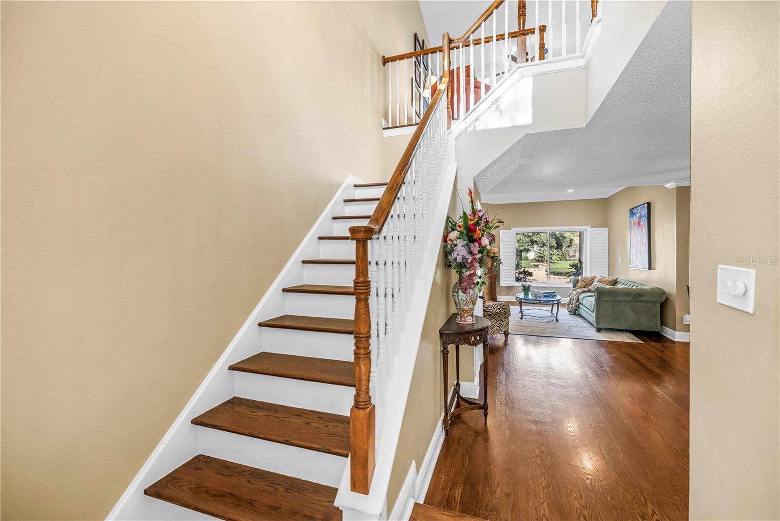 Exquisitely crafted hardwood stair treads complemented by solid-construction handrails. - 868 GLADES CT NE, ST PETERSBURG