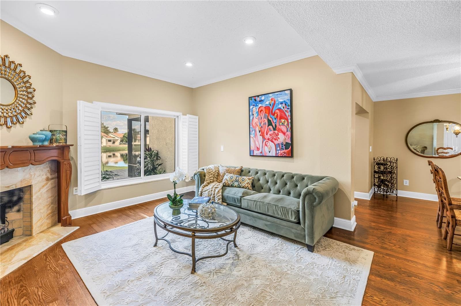 Formal living area featuring a wood-burning fireplace with an optional insert. - 868 GLADES CT NE, ST PETERSBURG