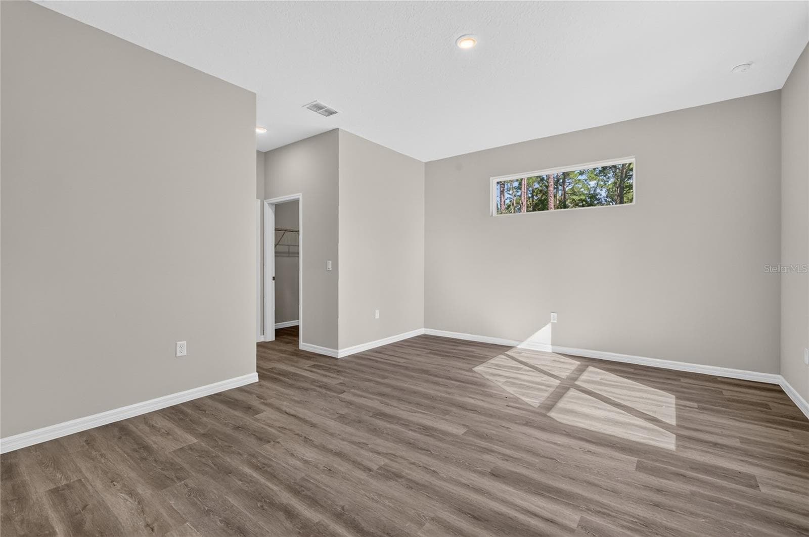 Primary bedroom with dual walk in closets - 41428 ROYAL TRAILS RD, EUSTIS