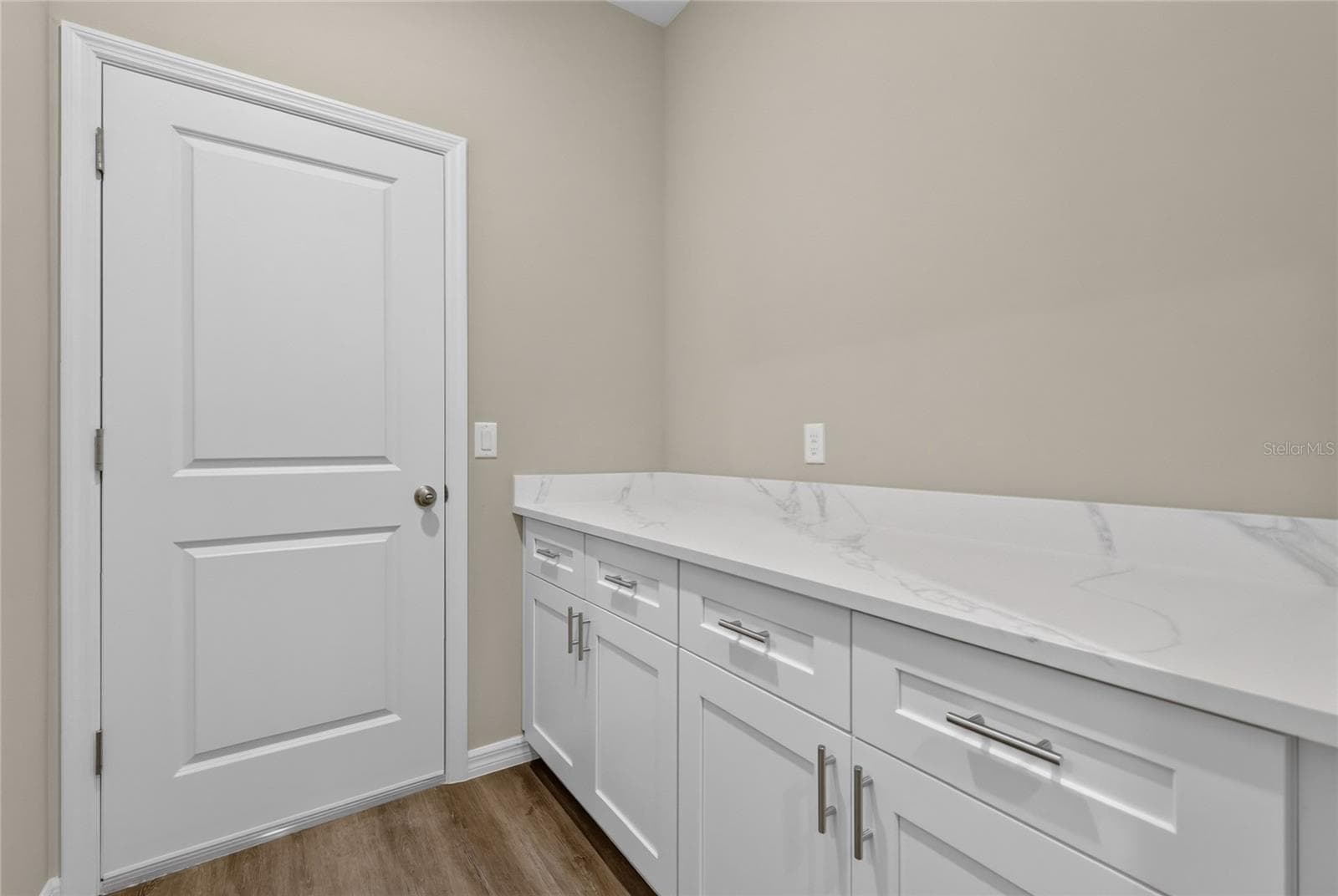 Folding area with cabinets and door leads to garage - 41428 ROYAL TRAILS RD, EUSTIS