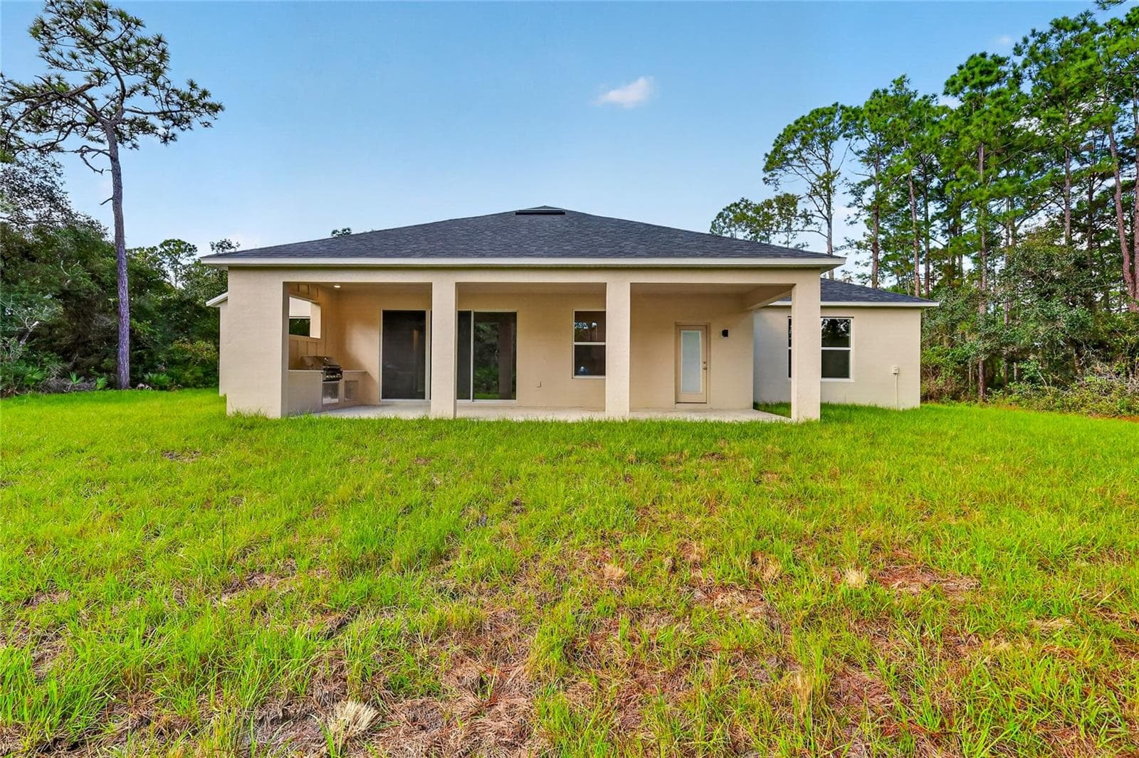 Back view of home with plenty of room for a pool - 41428 ROYAL TRAILS RD, EUSTIS