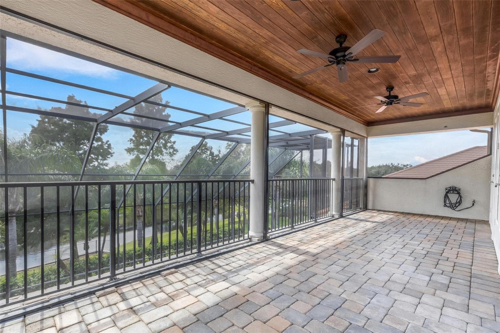 With wood ceiling above and brick pavers under foot. - 2734 BELLERIVE DR, LAKELAND