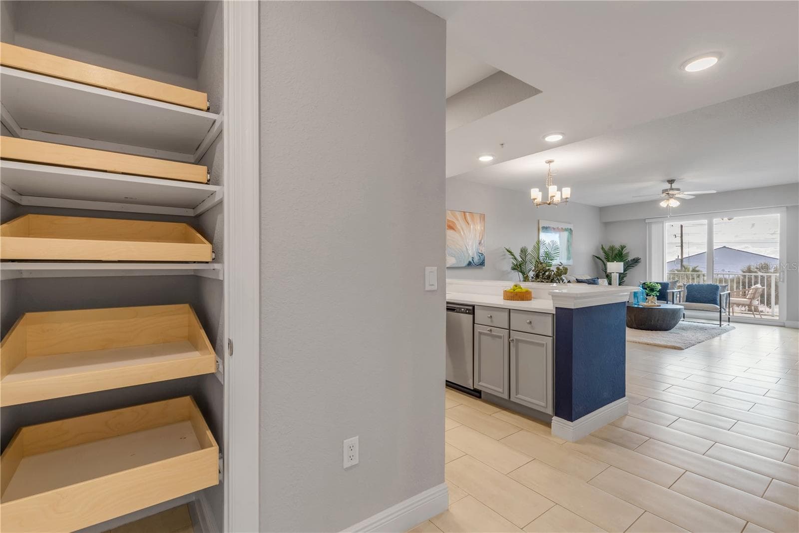 Hall closet with pull out shelves - 1 RIVERWALK DR #303, NEW SMYRNA BEACH