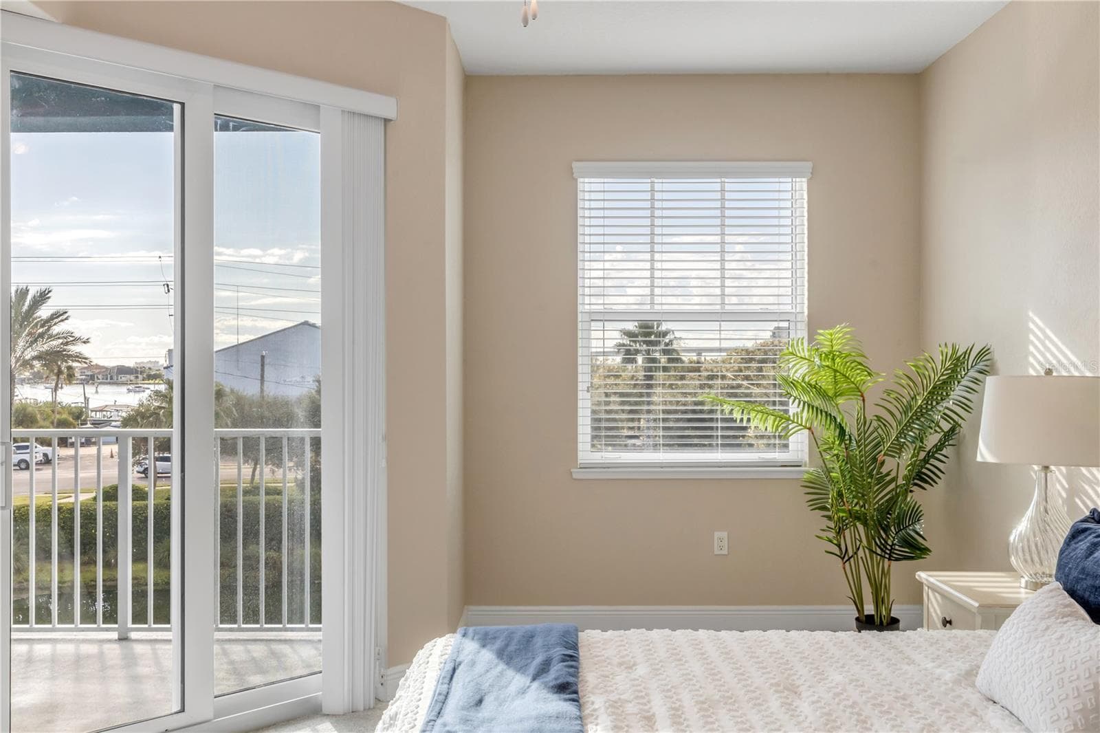 Primary Bedroom with slider to the back patio - 1 RIVERWALK DR #303, NEW SMYRNA BEACH