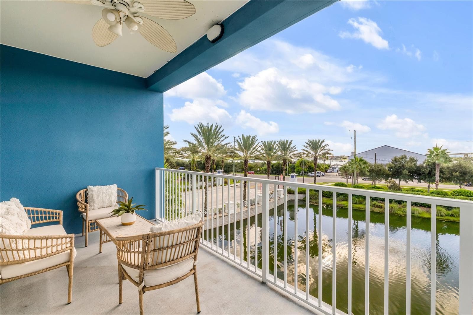Back Patio with pond and Marina view - 1 RIVERWALK DR #303, NEW SMYRNA BEACH