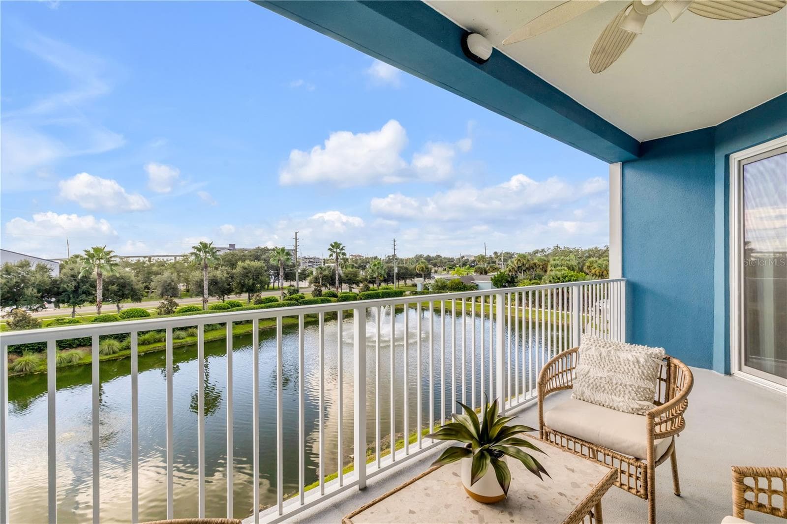 Back patio with pond and Marina view - 1 RIVERWALK DR #303, NEW SMYRNA BEACH