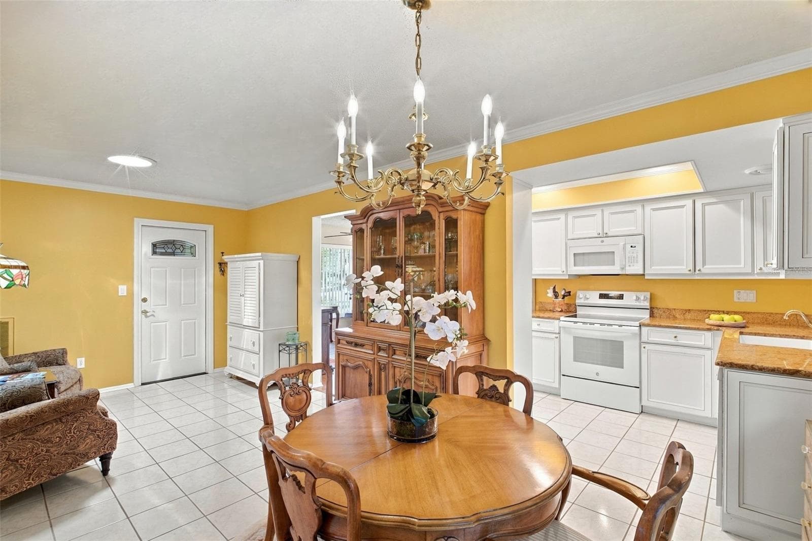 Breakfast nook & family room open to the kitchen~ - 1743 MACDONNELL DR, PALM HARBOR