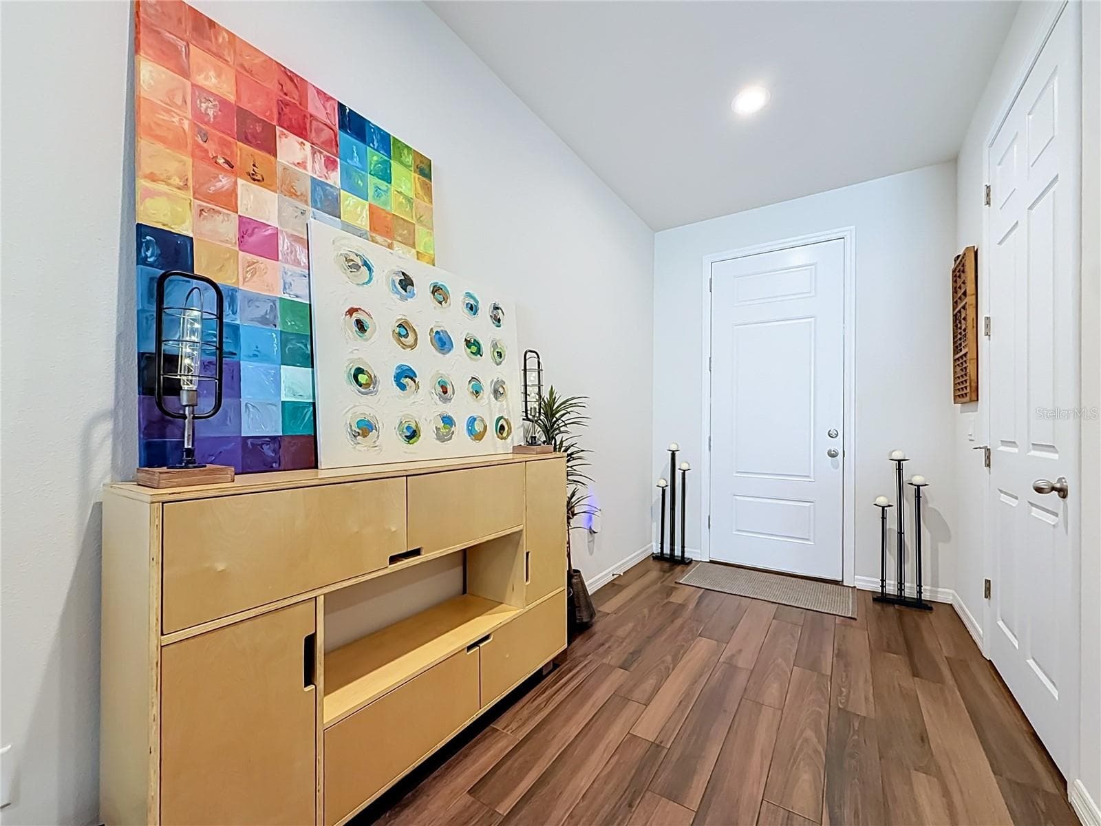 Step inside to discover a spacious OPEN FLOOR PLAN with soaring ceilings and beautiful WOOD-LOOK TILE flooring throughout the downstairs living areas. - 2270 MONTVIEW DR, CLEARWATER