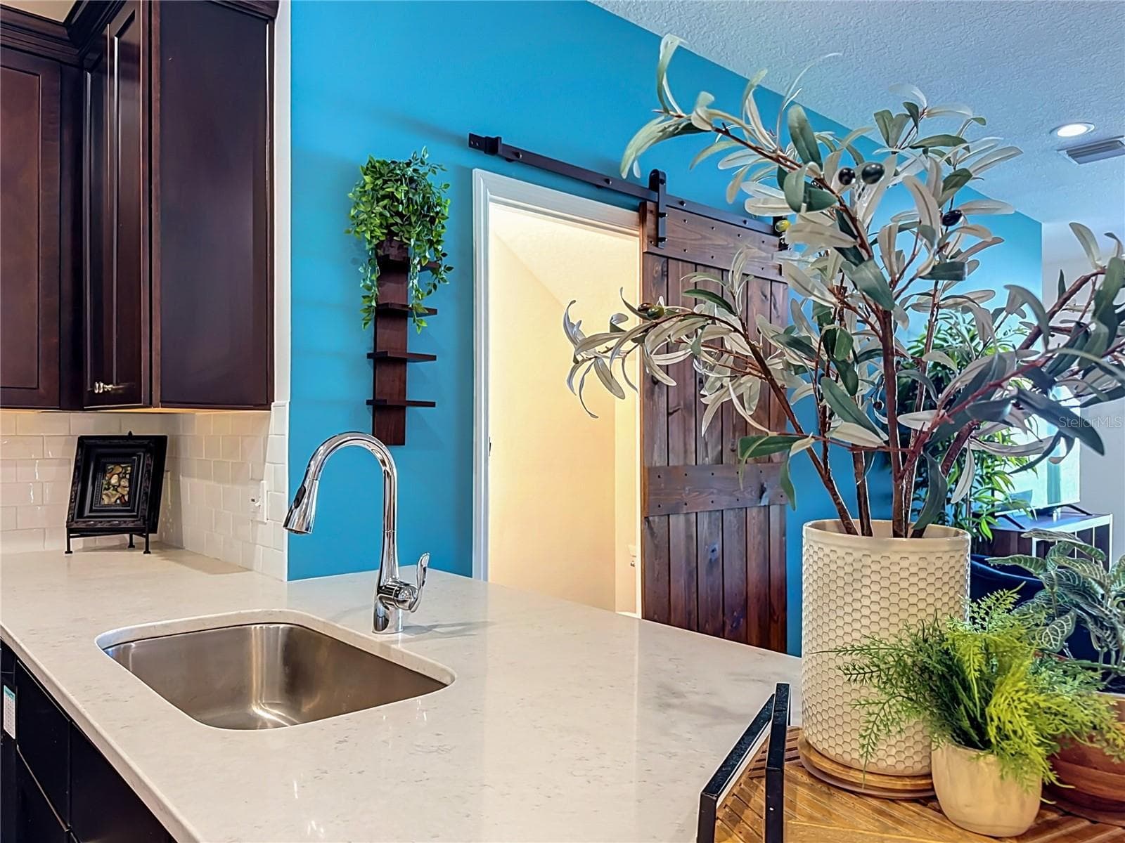 The seamless flow between the kitchen, living, and dining areas makes entertaining a breeze. - 2270 MONTVIEW DR, CLEARWATER