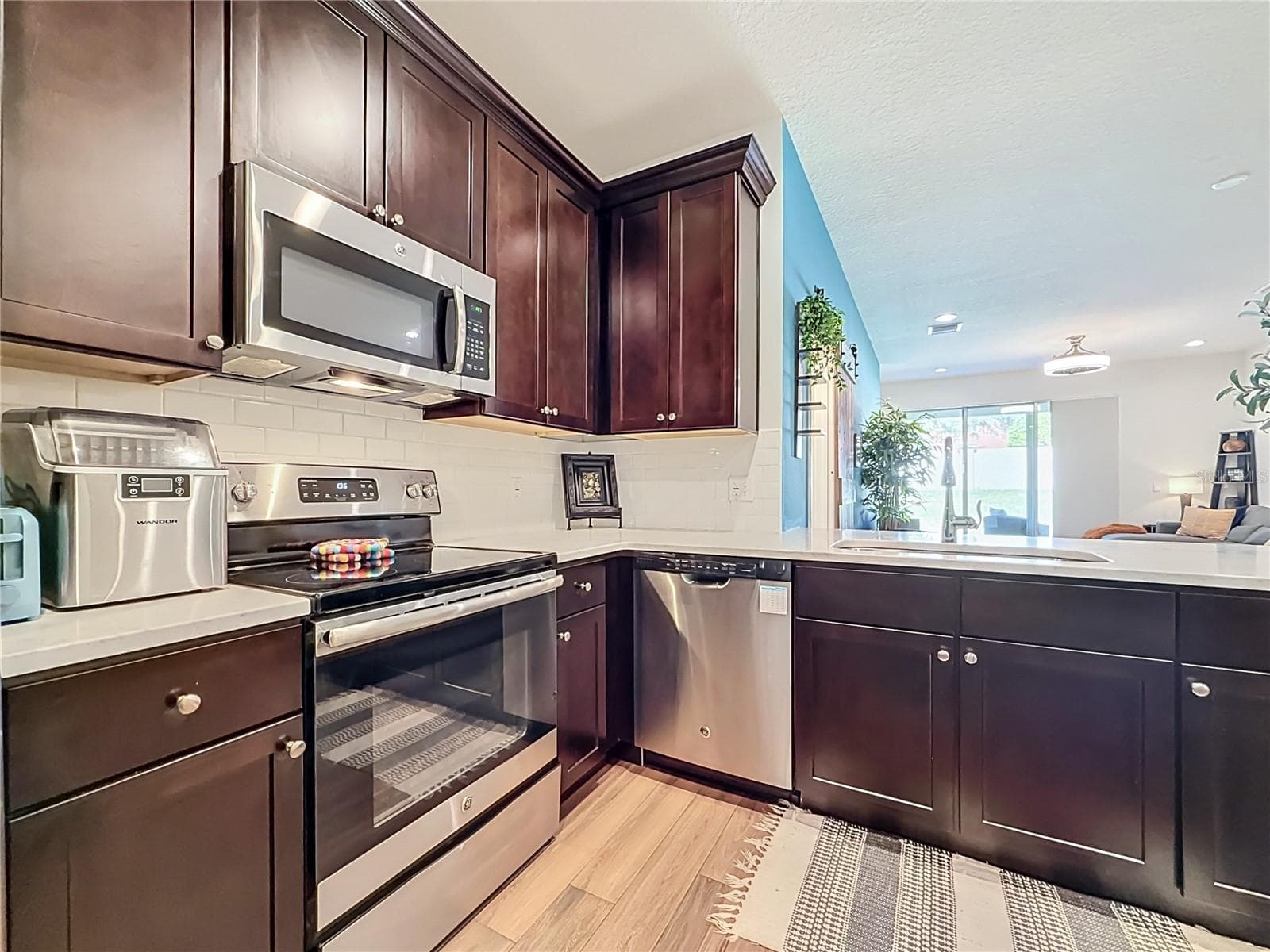The seamless flow between the kitchen, living, and dining areas makes entertaining a breeze. - 2270 MONTVIEW DR, CLEARWATER