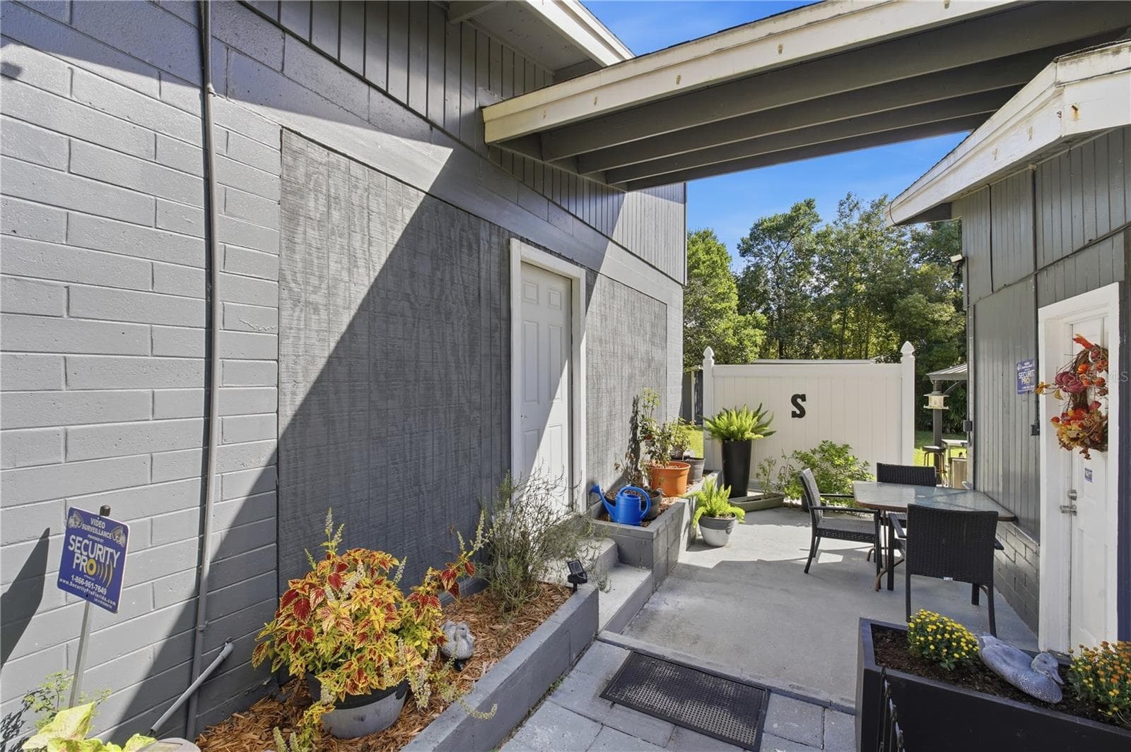 Breezeway from garage to bed 4/office - 735 N SANS SOUCI AVE, DELAND