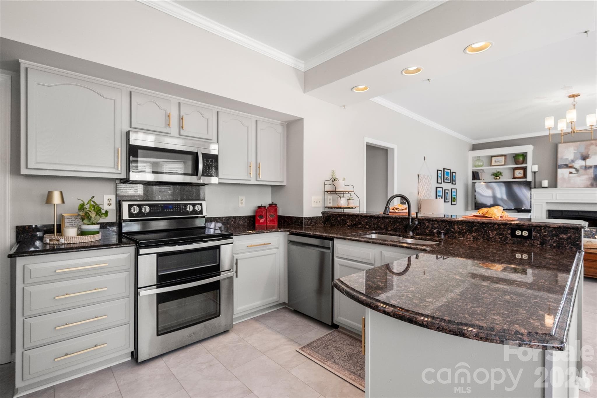 Kitchen with stainless steel appliances & granite countertops - 15229 Dartford Lane, Mint Hill