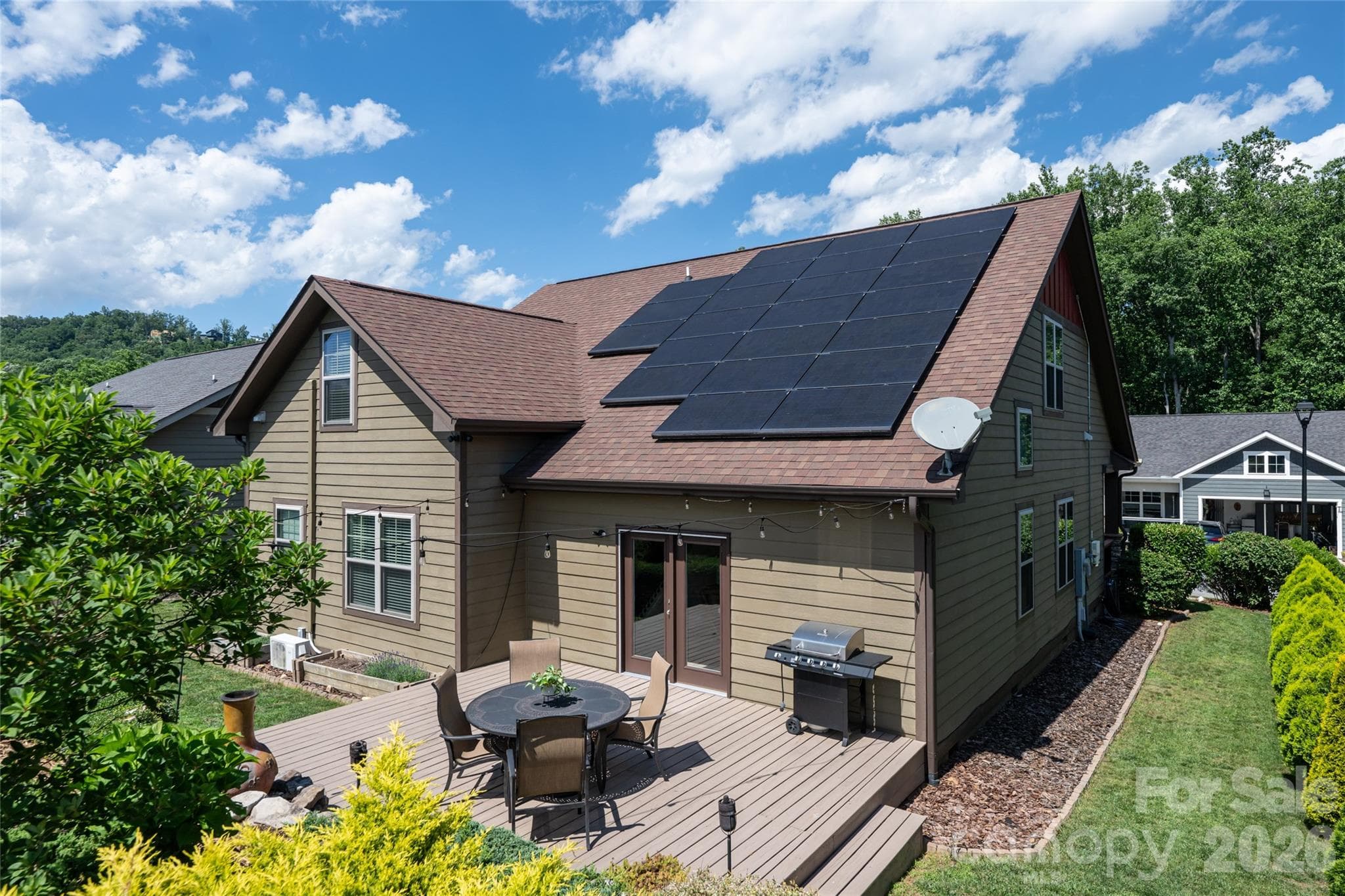 Aerial view of the rear elevation showing the fully paid passive solar panel array on the roof. - 17 Asher Lane, Arden