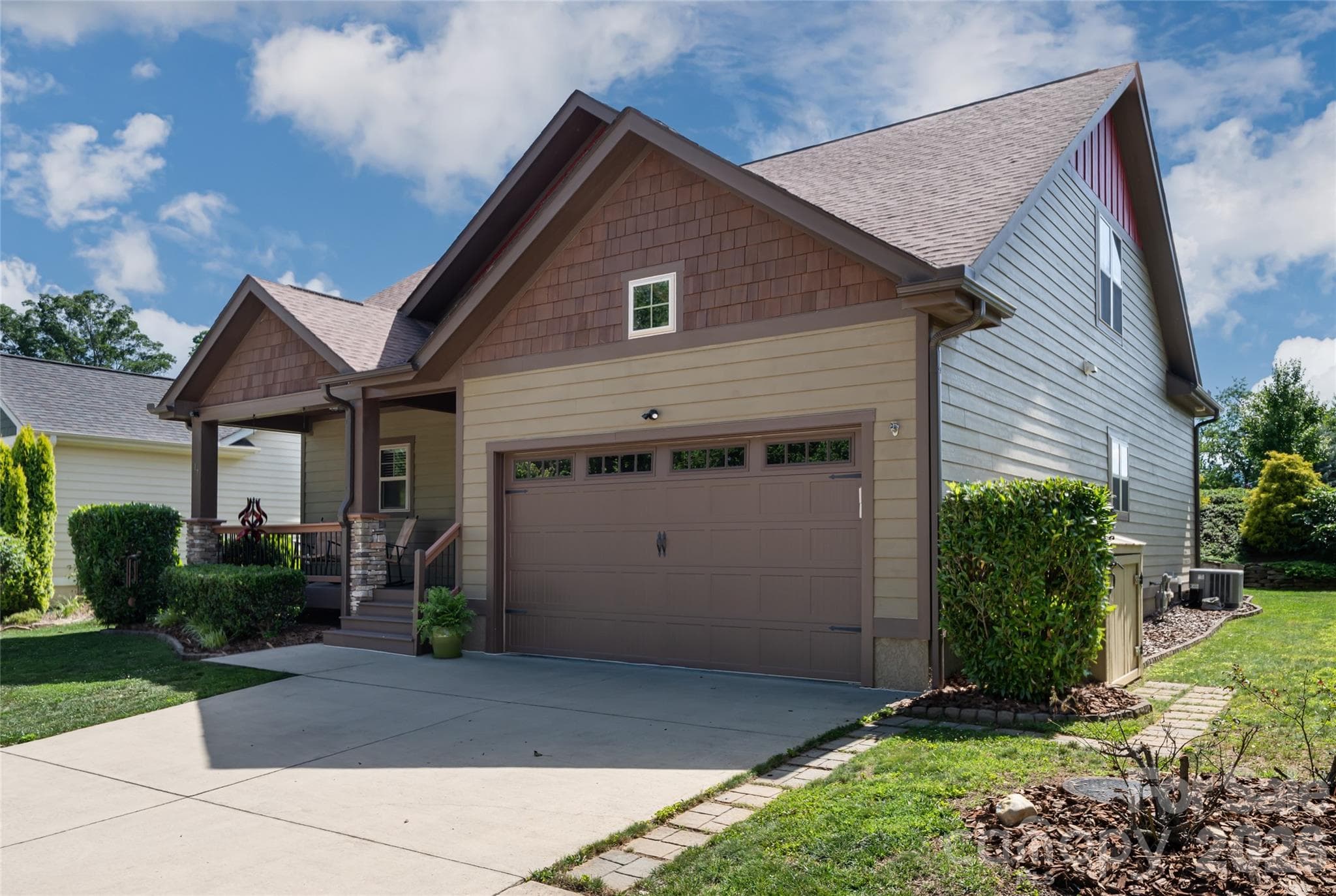 Curb view of the low-maintenance front yard and craftsman facade, minutes from Biltmore Park Town Square and Asheville Regional Airport. - 17 Asher Lane, Arden