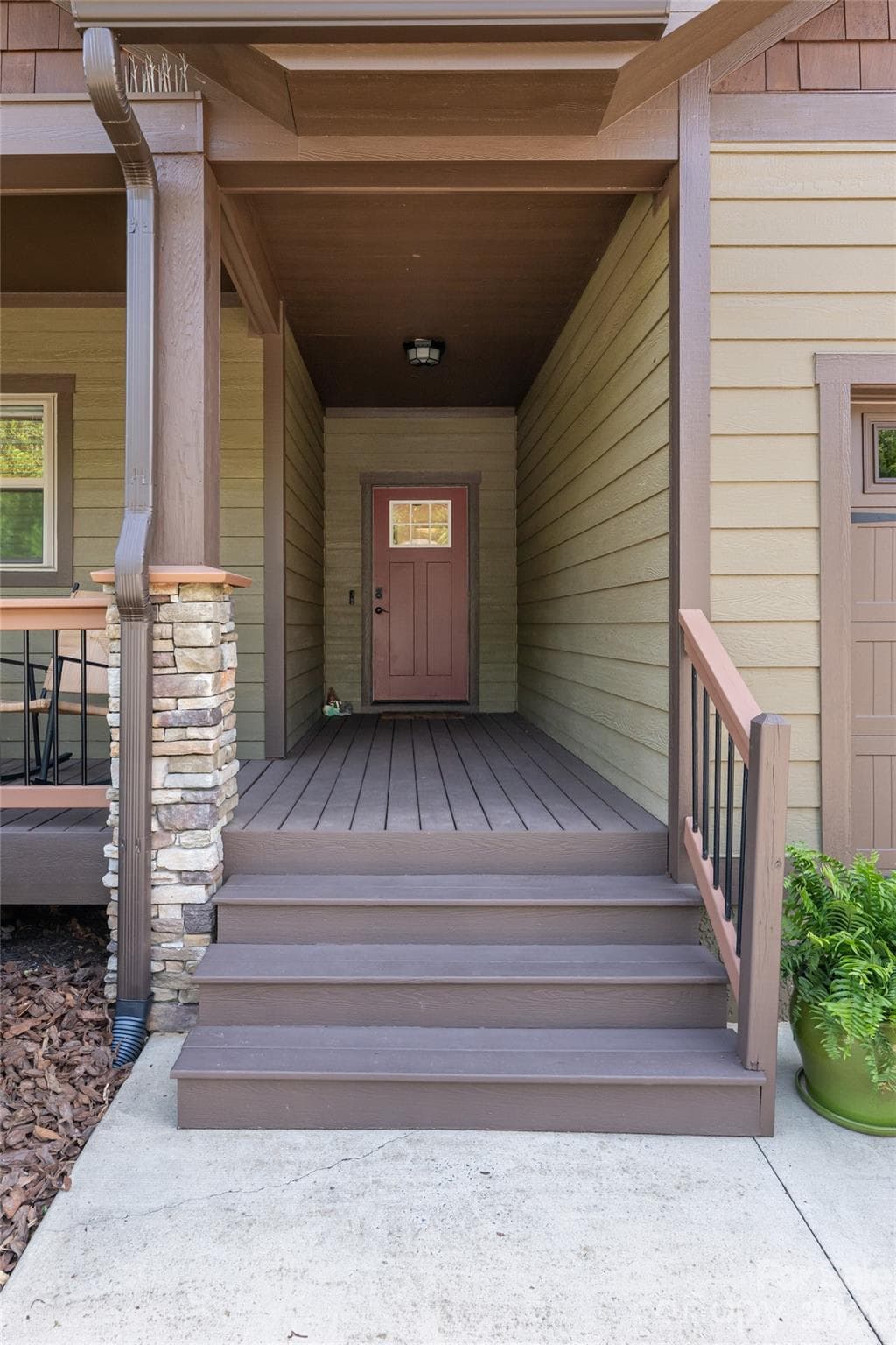 Covered front entry with composite steps and craftsman trim detail leading to the main door. - 17 Asher Lane, Arden