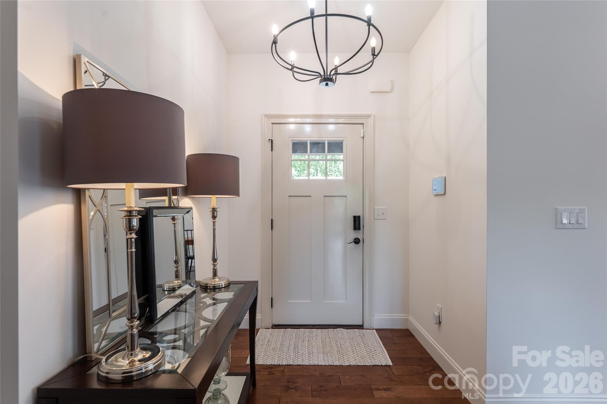 Front foyer with glass-paneled entry door and space for a console table. - 17 Asher Lane, Arden