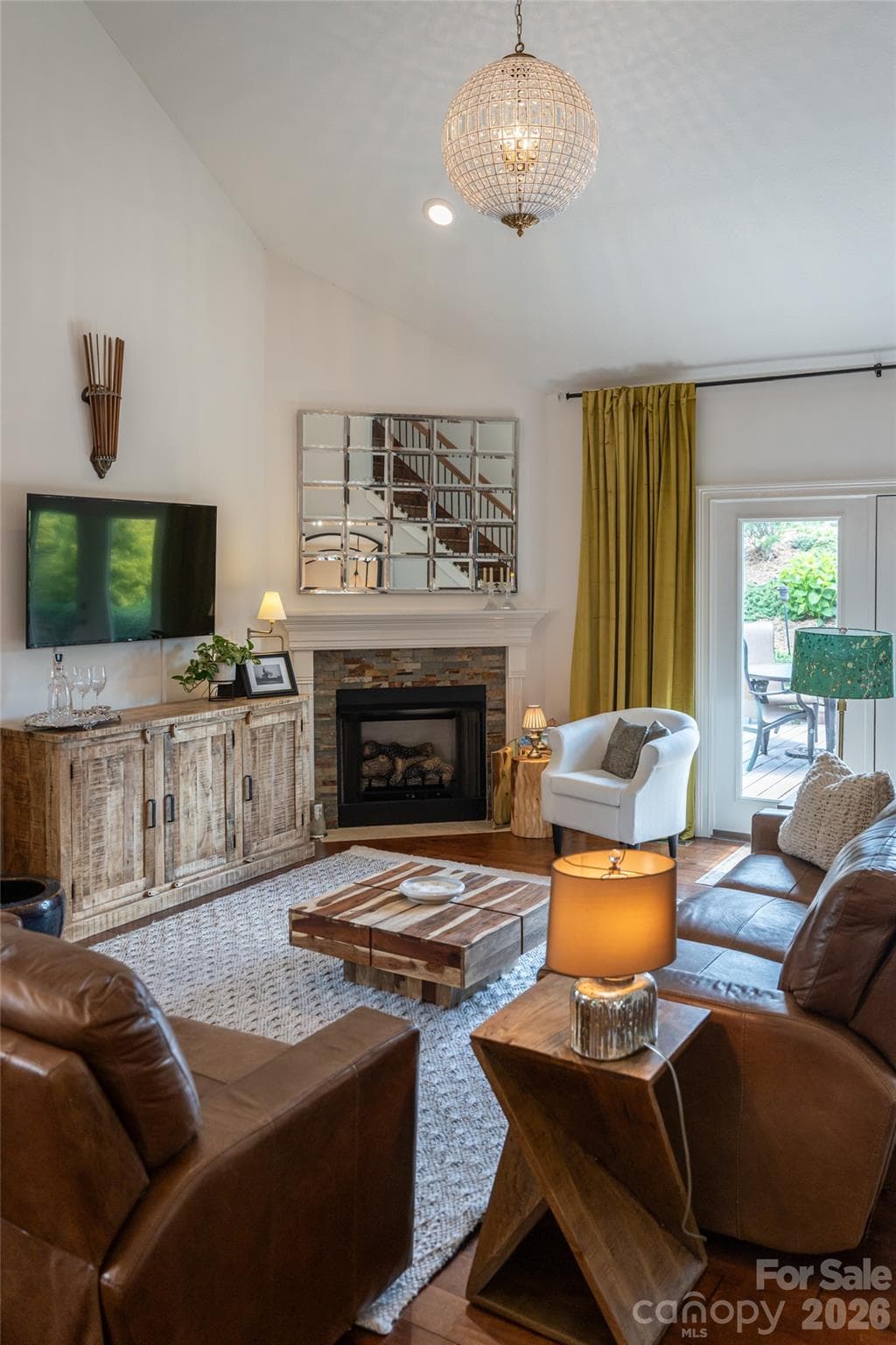 Gas-log fireplace wall with console, the focal point of the great room. - 17 Asher Lane, Arden