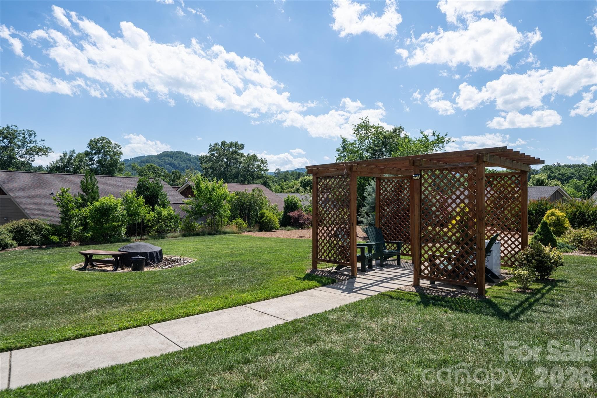 Community green space with pergola — a neighborhood amenity maintained by the $500-per-year HOA. - 17 Asher Lane, Arden