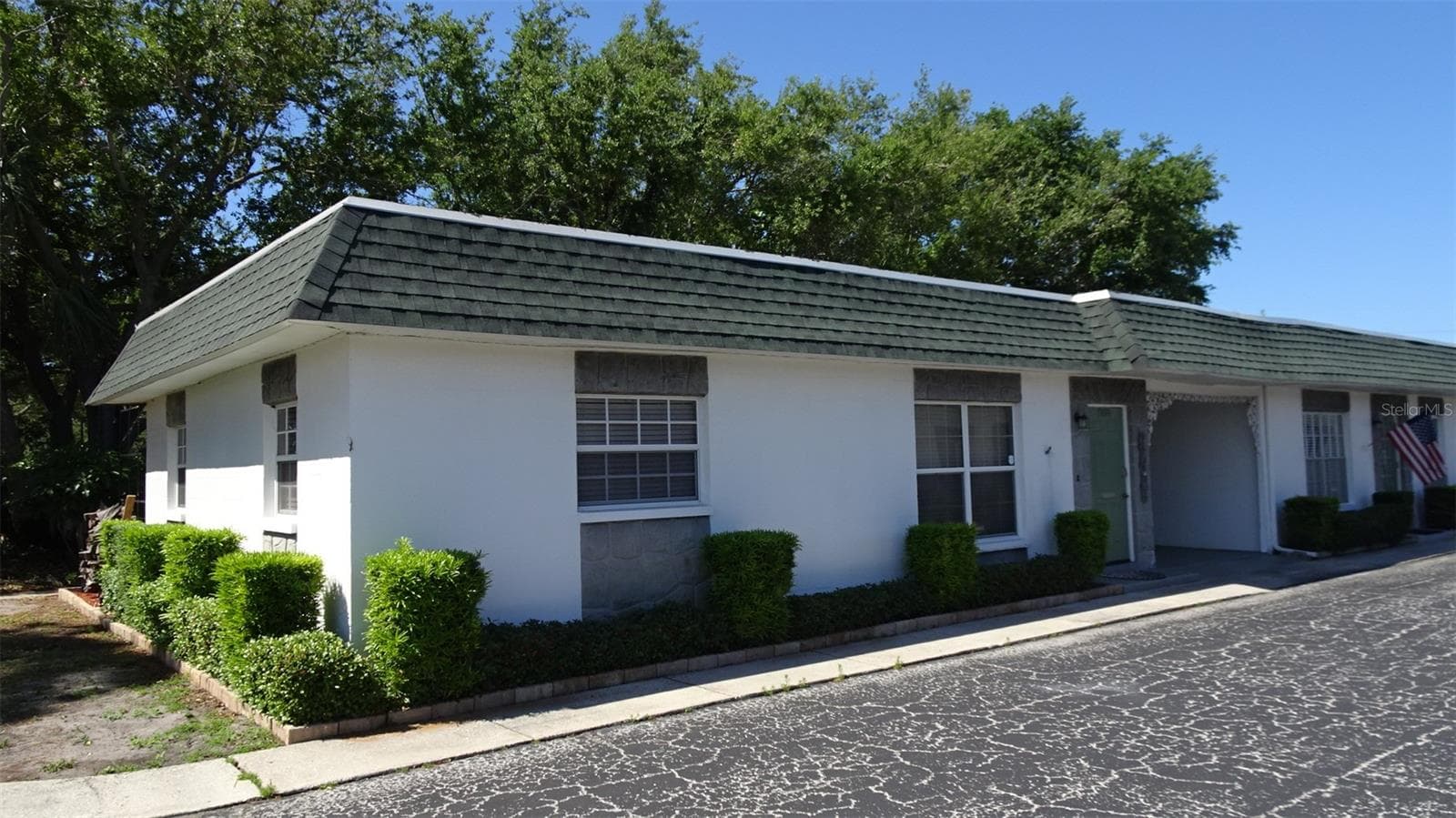 Private carport with guest parking just to the left of this villa - 7800 38TH TER N, ST PETERSBURG