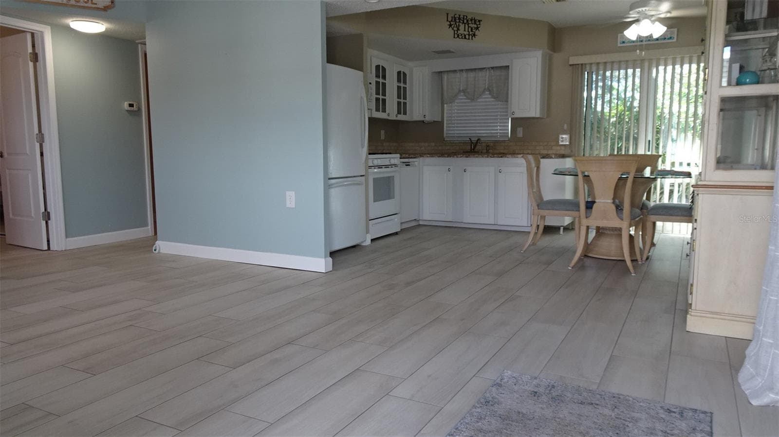 Living room, porcelain tile floors. - 7800 38TH TER N, ST PETERSBURG