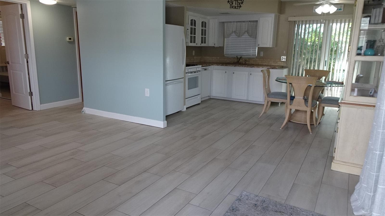 Living room into dining - 7800 38TH TER N, ST PETERSBURG
