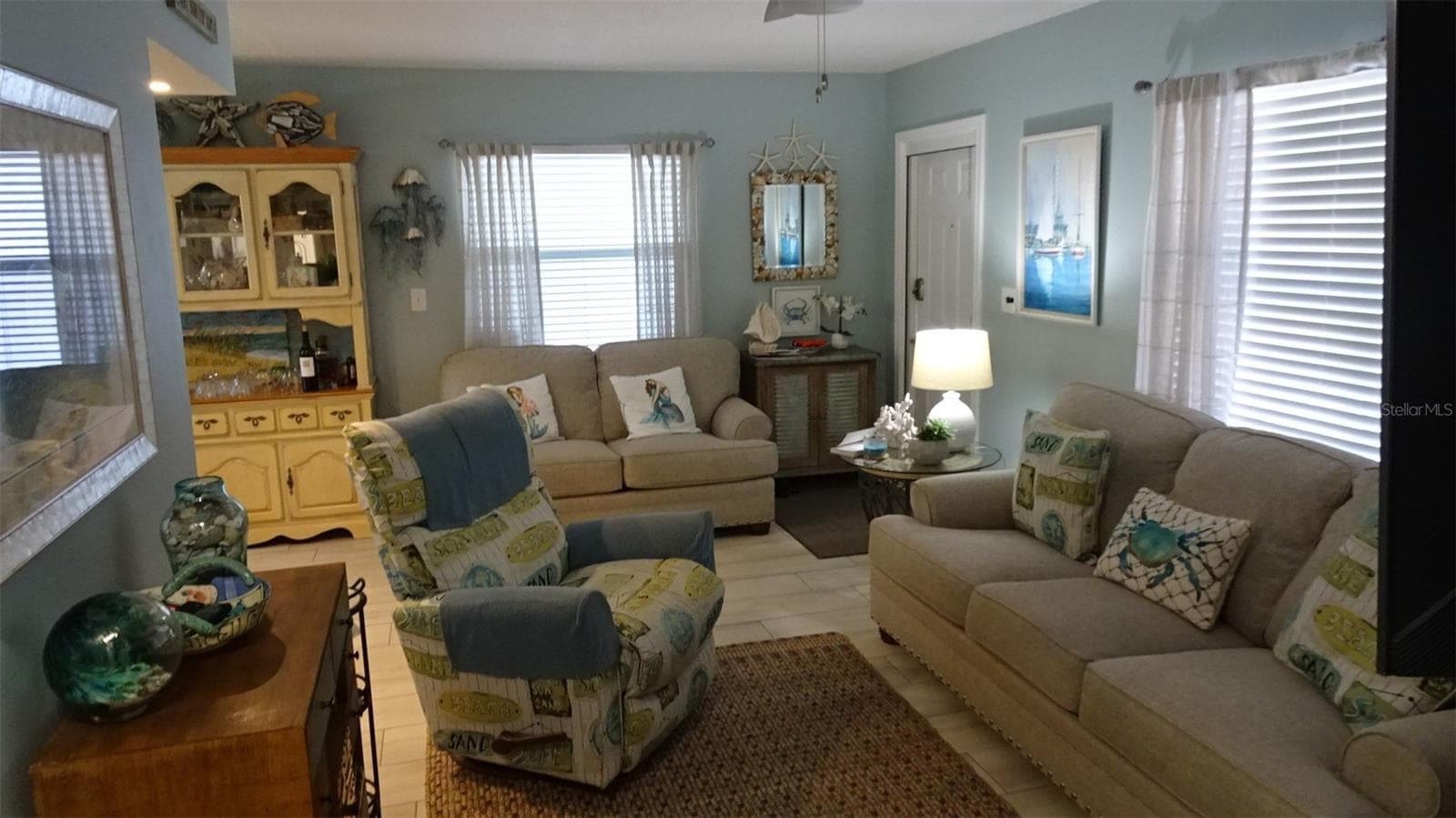 Living room furnished when sellers still lived there. - 7800 38TH TER N, ST PETERSBURG