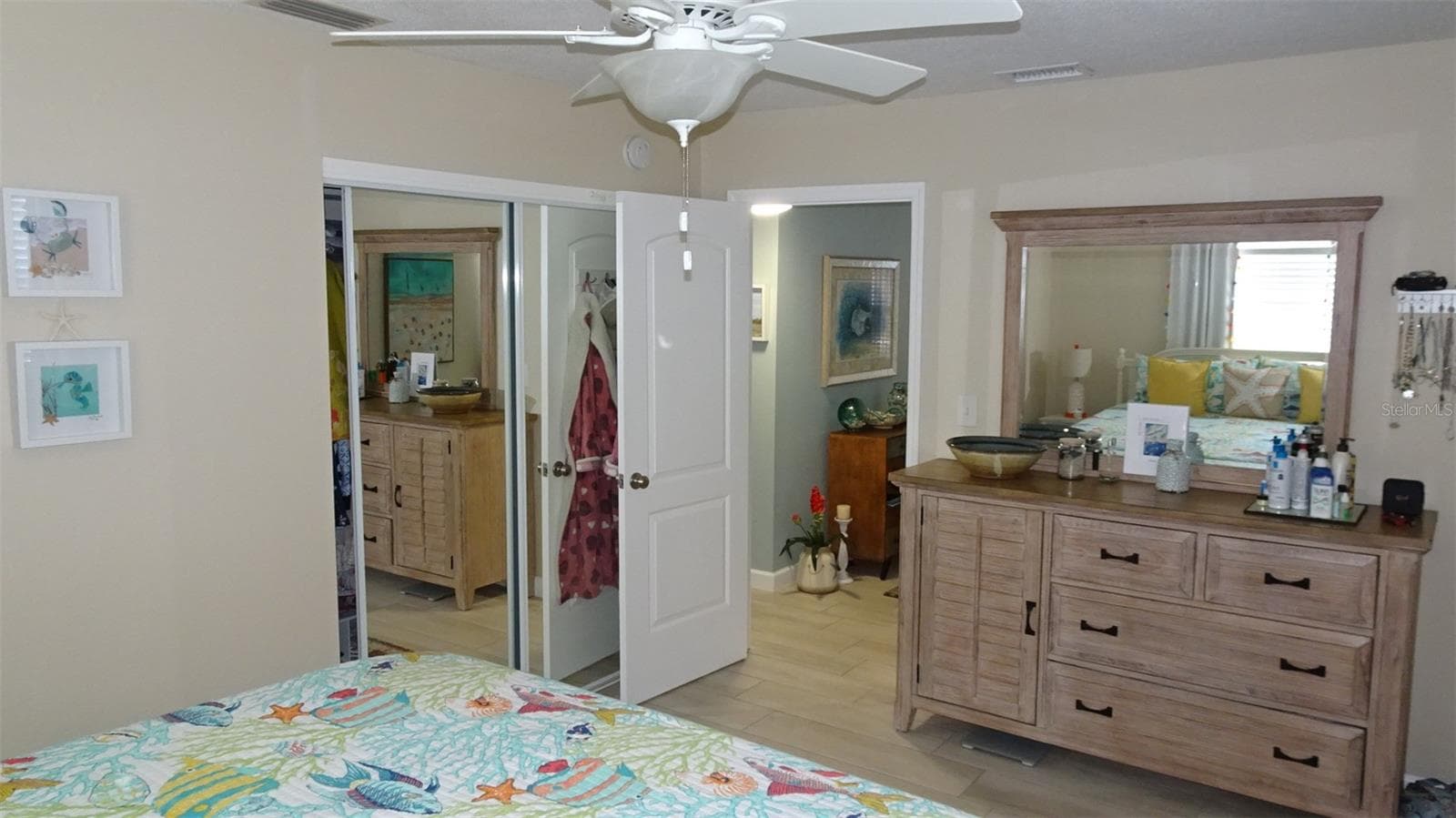 Front bedroom as furnished, mirrored glass closet doors. - 7800 38TH TER N, ST PETERSBURG