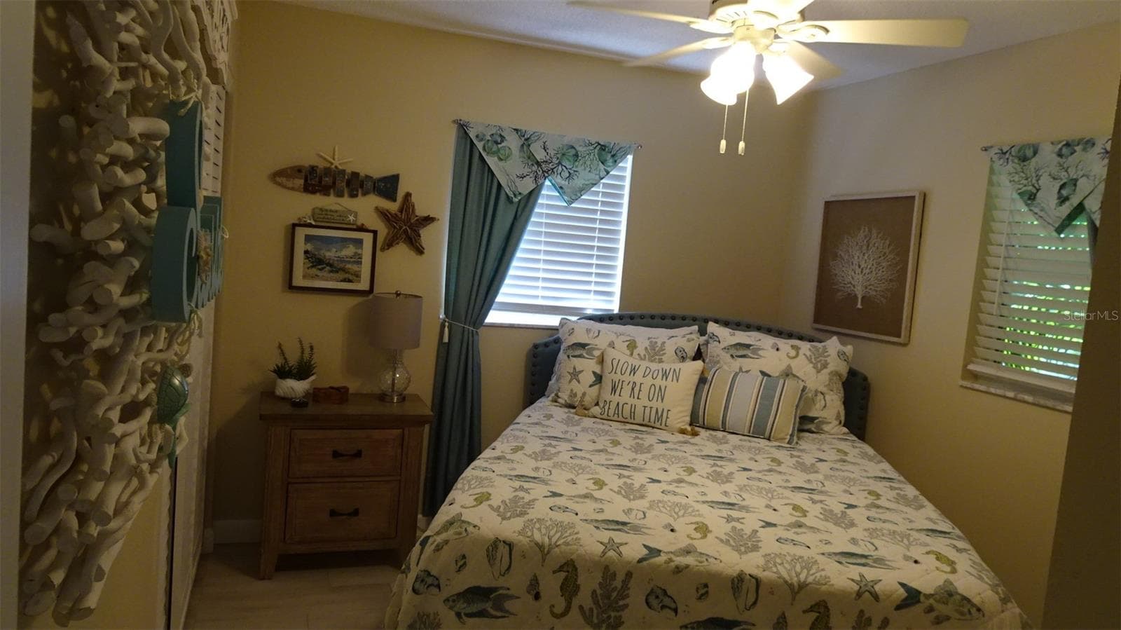 Rear bedroom bed as furnished by sellers. - 7800 38TH TER N, ST PETERSBURG