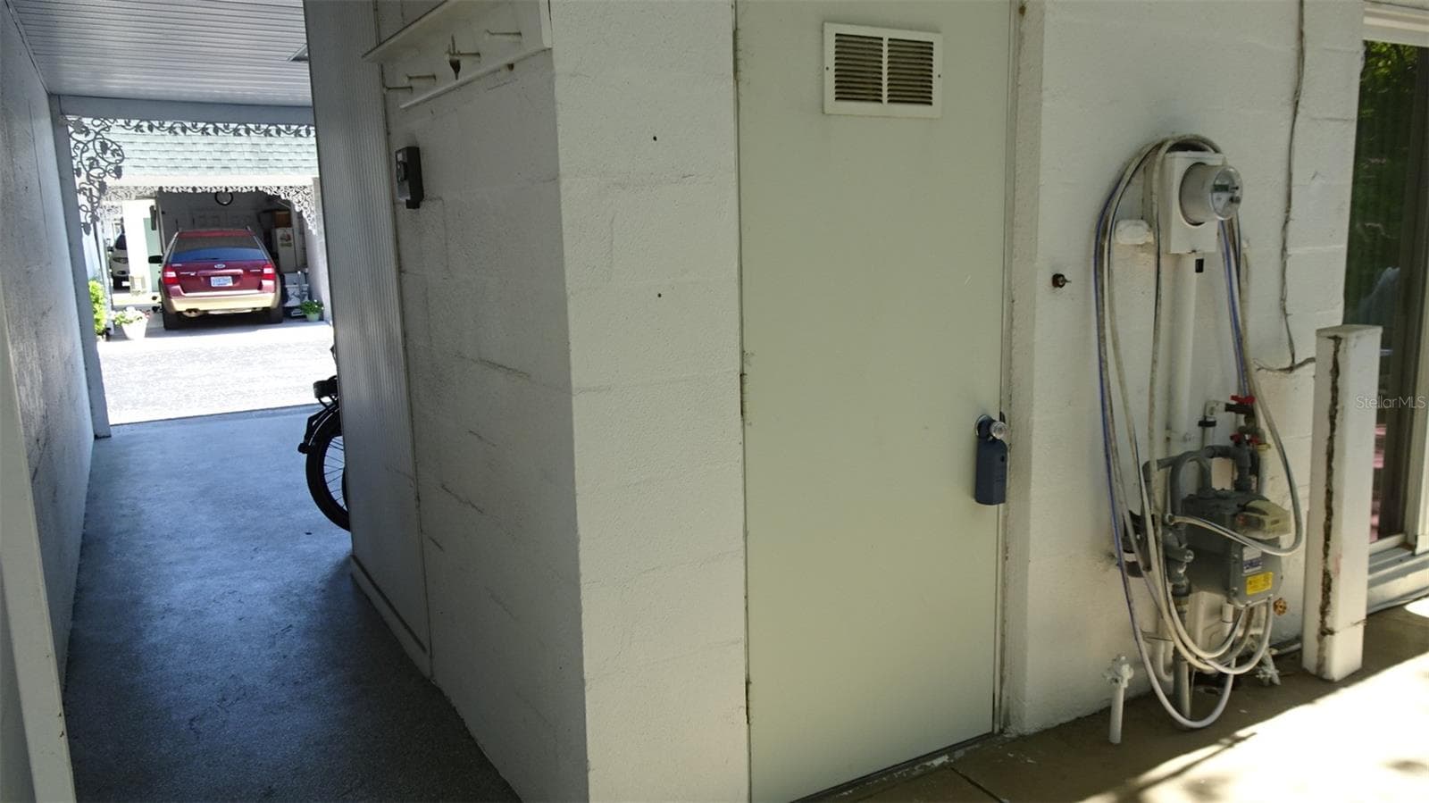Laundry room behind the carport. - 7800 38TH TER N, ST PETERSBURG