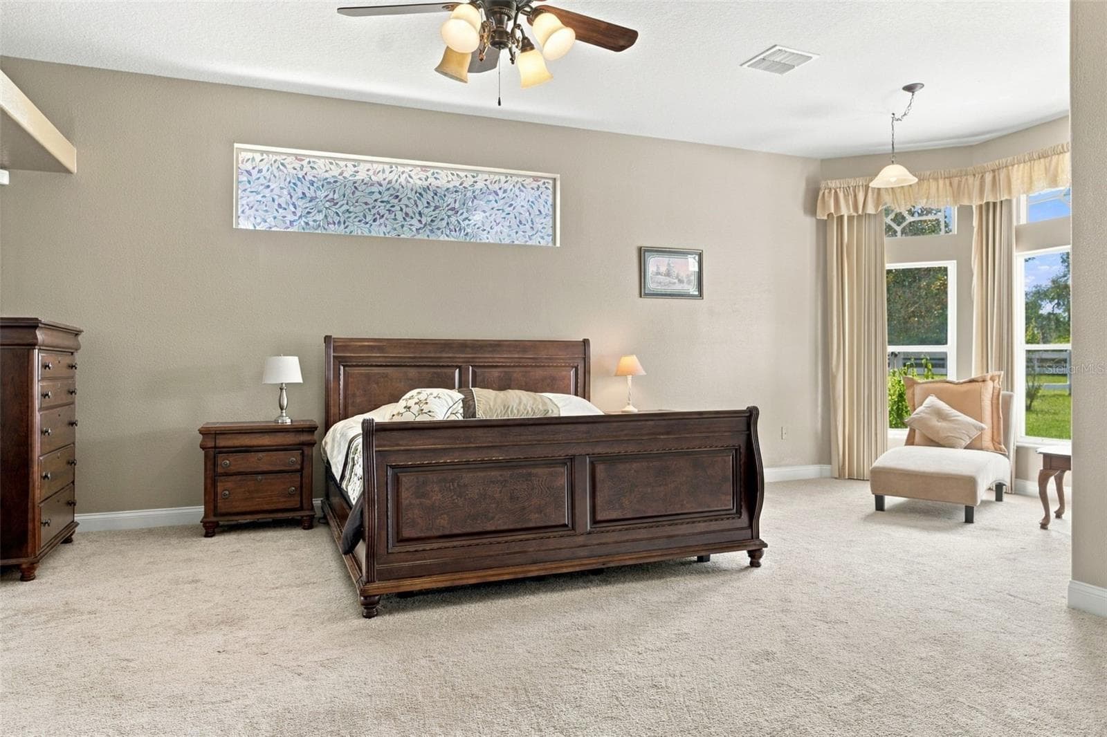 Spacious primary bedroom with sitting area to watch the horses - 6722 W SENTINEL BLUFF PATH, BEVERLY HILLS