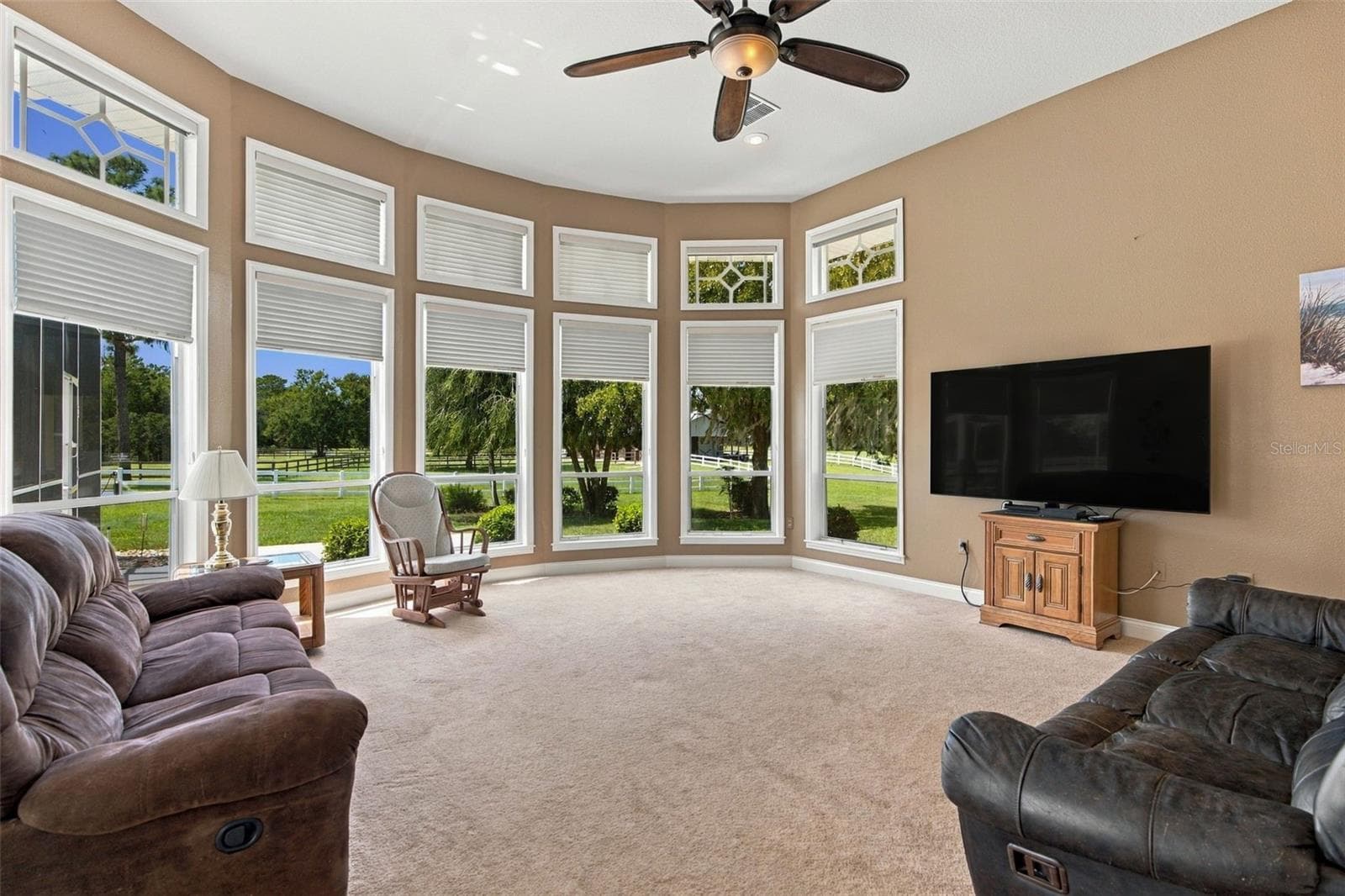 Expansive windows in family room with views of the barn and pastures - 6722 W SENTINEL BLUFF PATH, BEVERLY HILLS