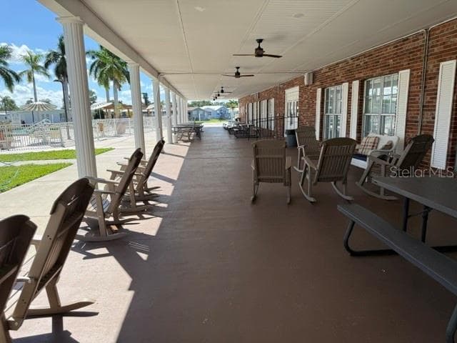 Covered sitting area outside clubhouse - 3412 OAKWOOD BLVD N, SARASOTA
