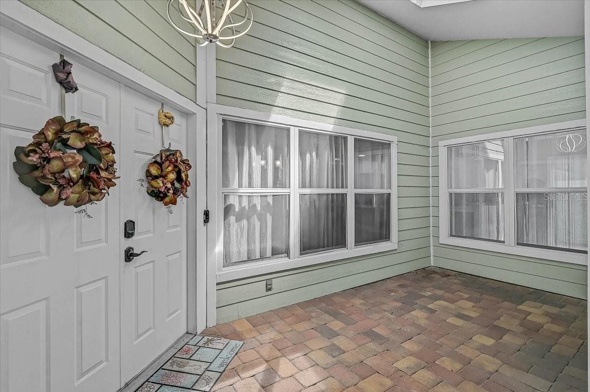 Covered Patio Outside Front Door 19' x 8' - 7739 33RD LN E, SARASOTA