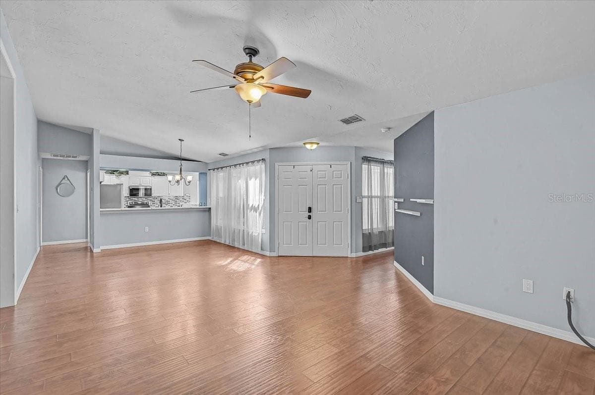 Living Room, Dining Room, Kitchen. Front Double Doors. - 7739 33RD LN E, SARASOTA