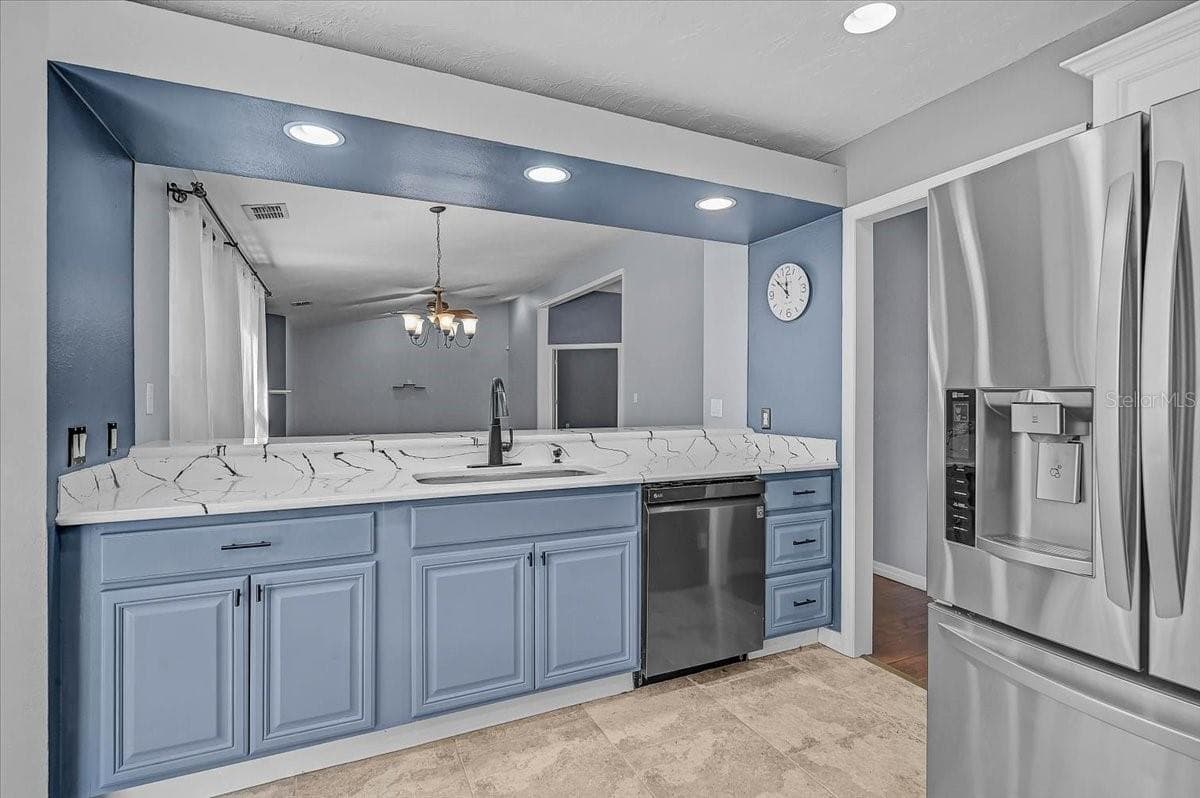 Kitchen Looking into Dining Room and Living Room. - 7739 33RD LN E, SARASOTA