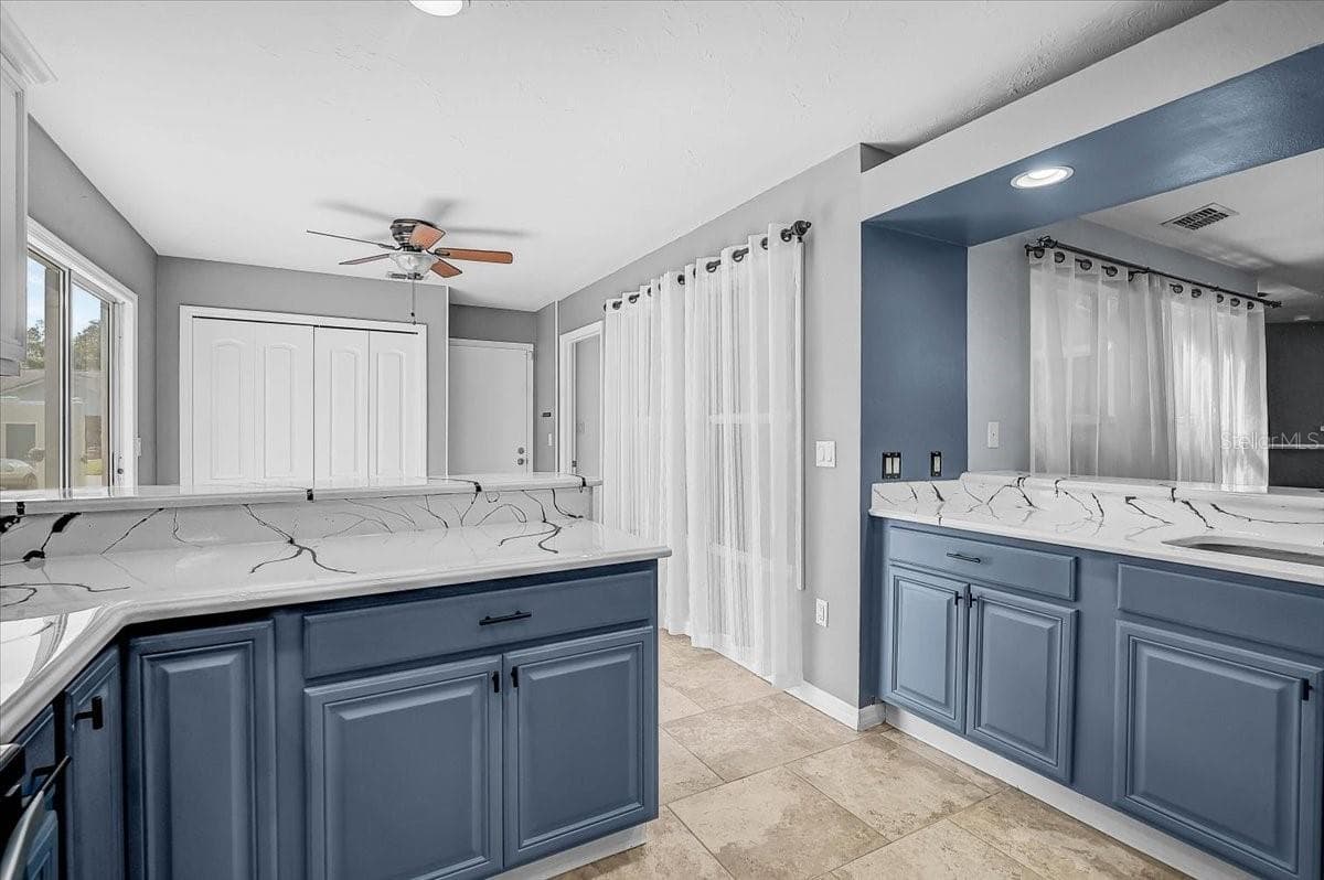 Kitchen Looking into Dinette and Dining Room - 7739 33RD LN E, SARASOTA