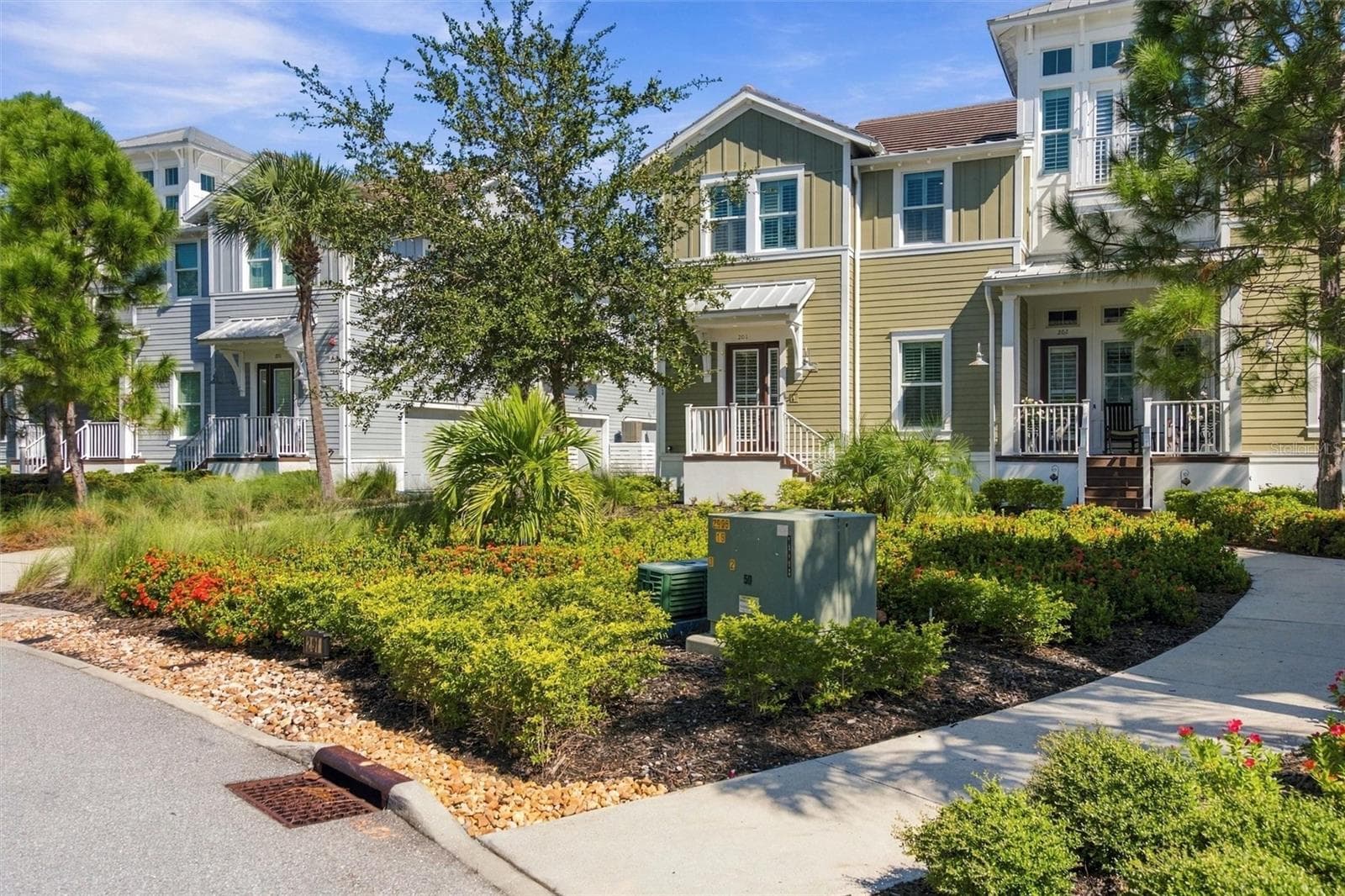 Beautifully manicured landscaping throughout the neighborhood - 291 COMPASS POINT DR #201, BRADENTON