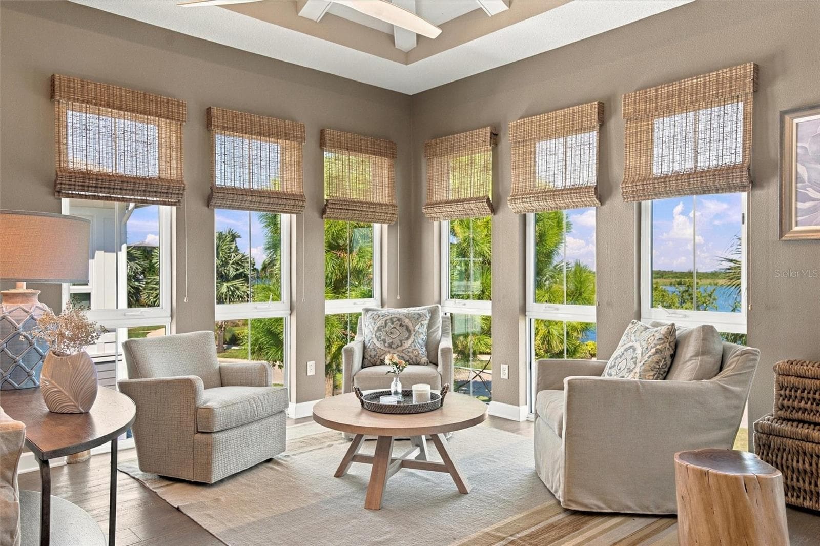 Enjoy peaceful Sapphire Lake views from this beautifully appointed home, featuring an open-concept floor plan, soaring vaulted ceilings, and Mohawk engineered hardwood flooring. - 291 COMPASS POINT DR #201, BRADENTON