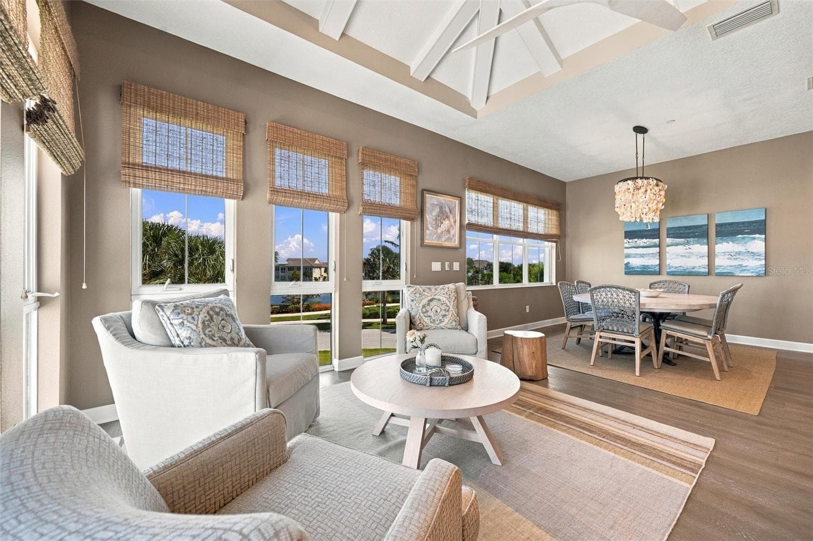 Enjoy peaceful Sapphire Lake views from this beautifully appointed home, featuring an open-concept floor plan, soaring vaulted ceilings, and Mohawk engineered hardwood flooring. - 291 COMPASS POINT DR #201, BRADENTON